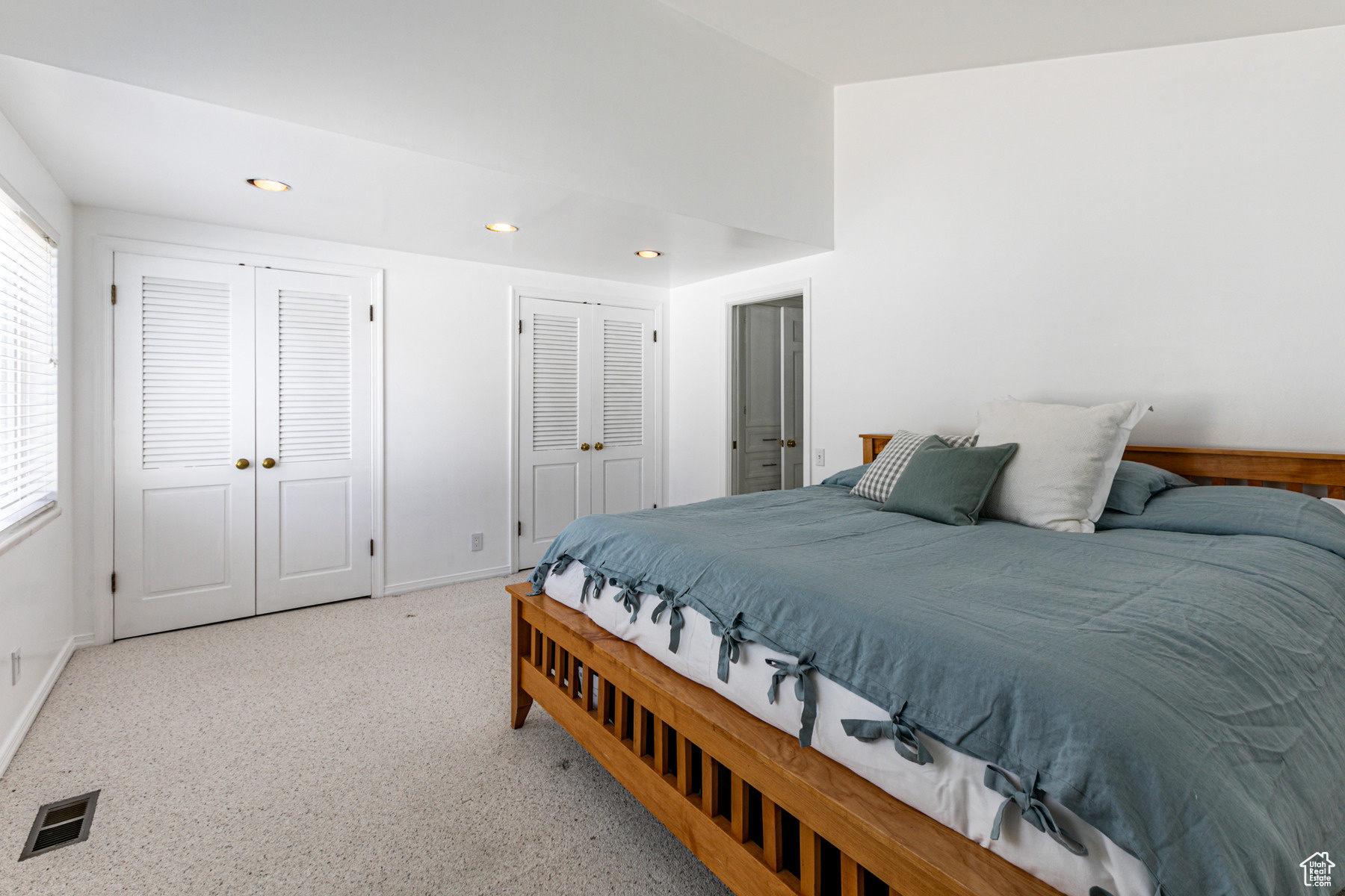 Bedroom featuring two closets  and built-in drawers