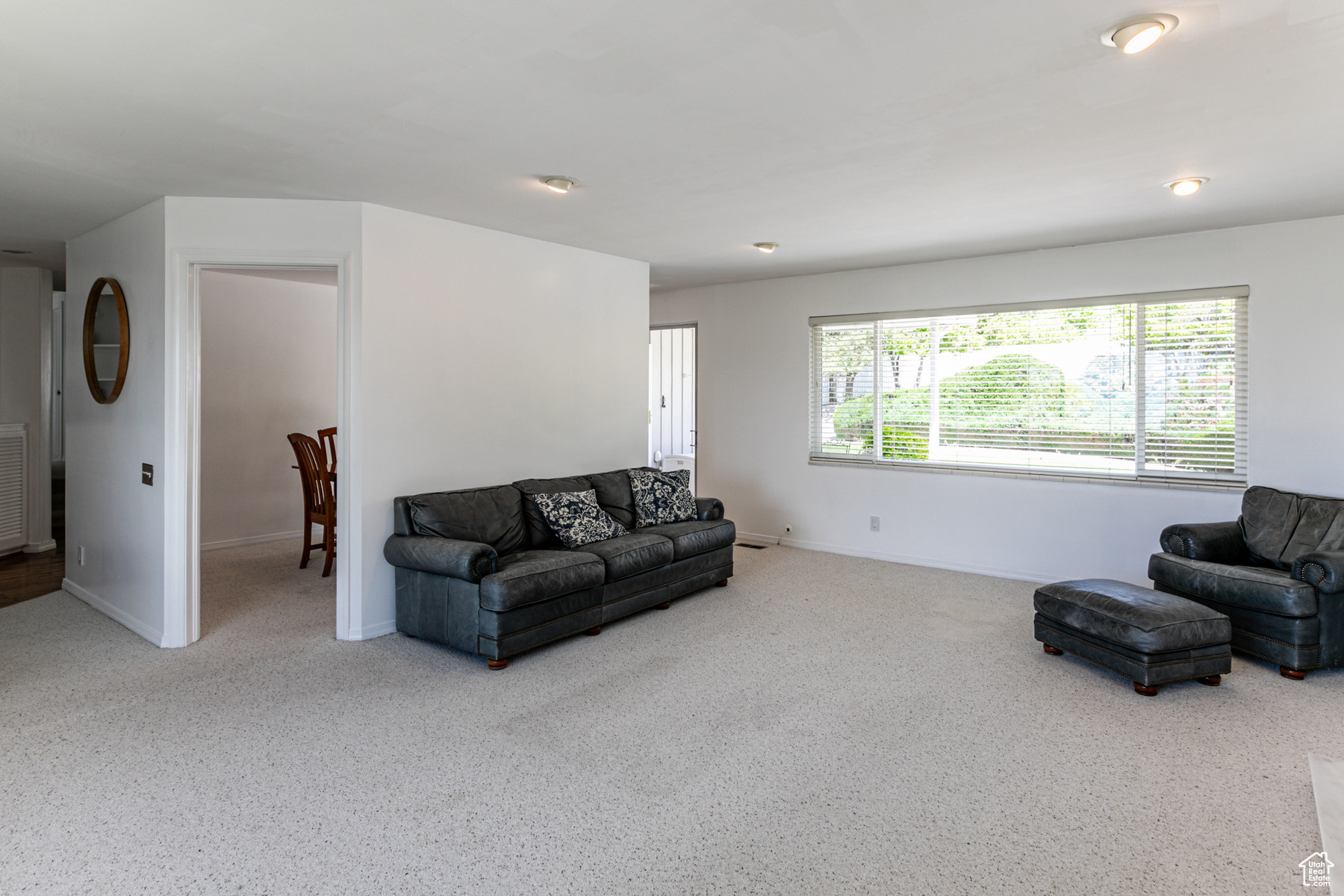 Living room featuring large windows with lots of light