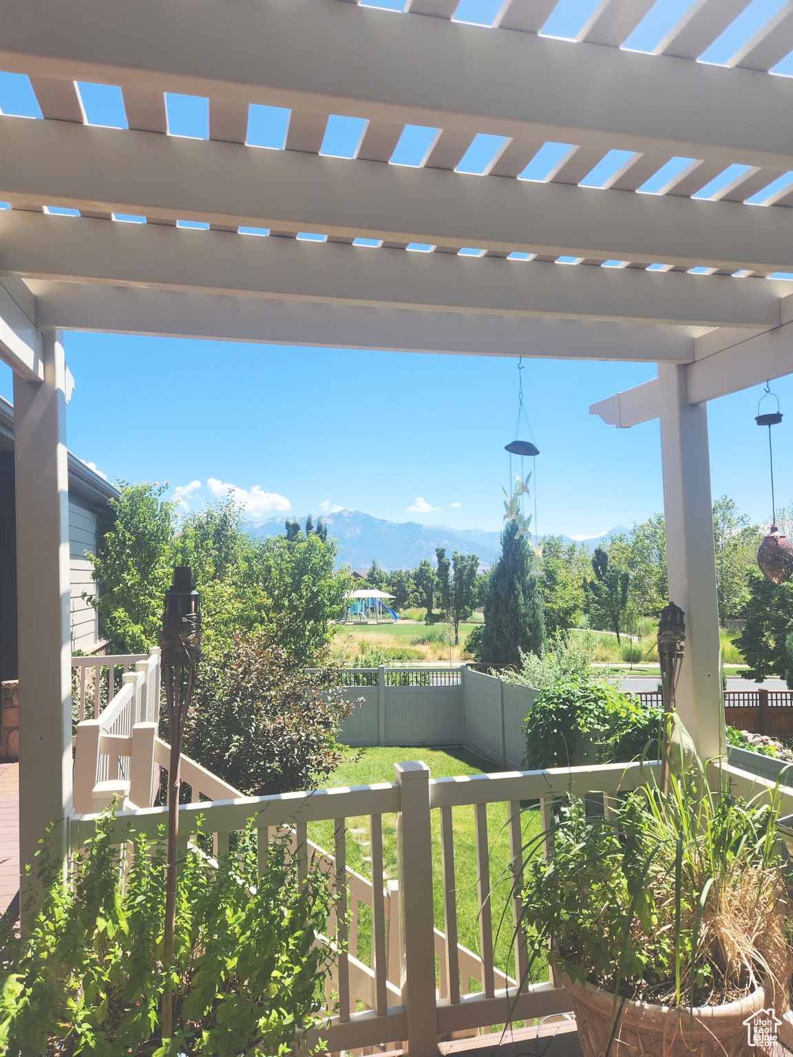 Exterior space with a pergola and a mountain view