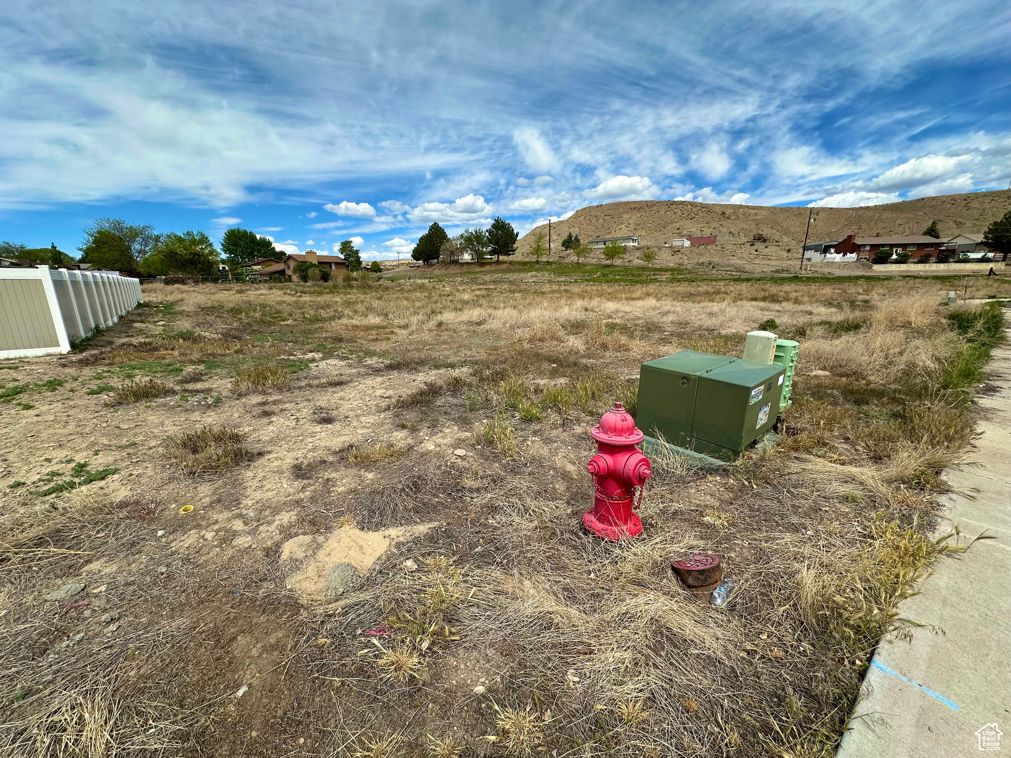 View of yard with a rural view and a mountain view