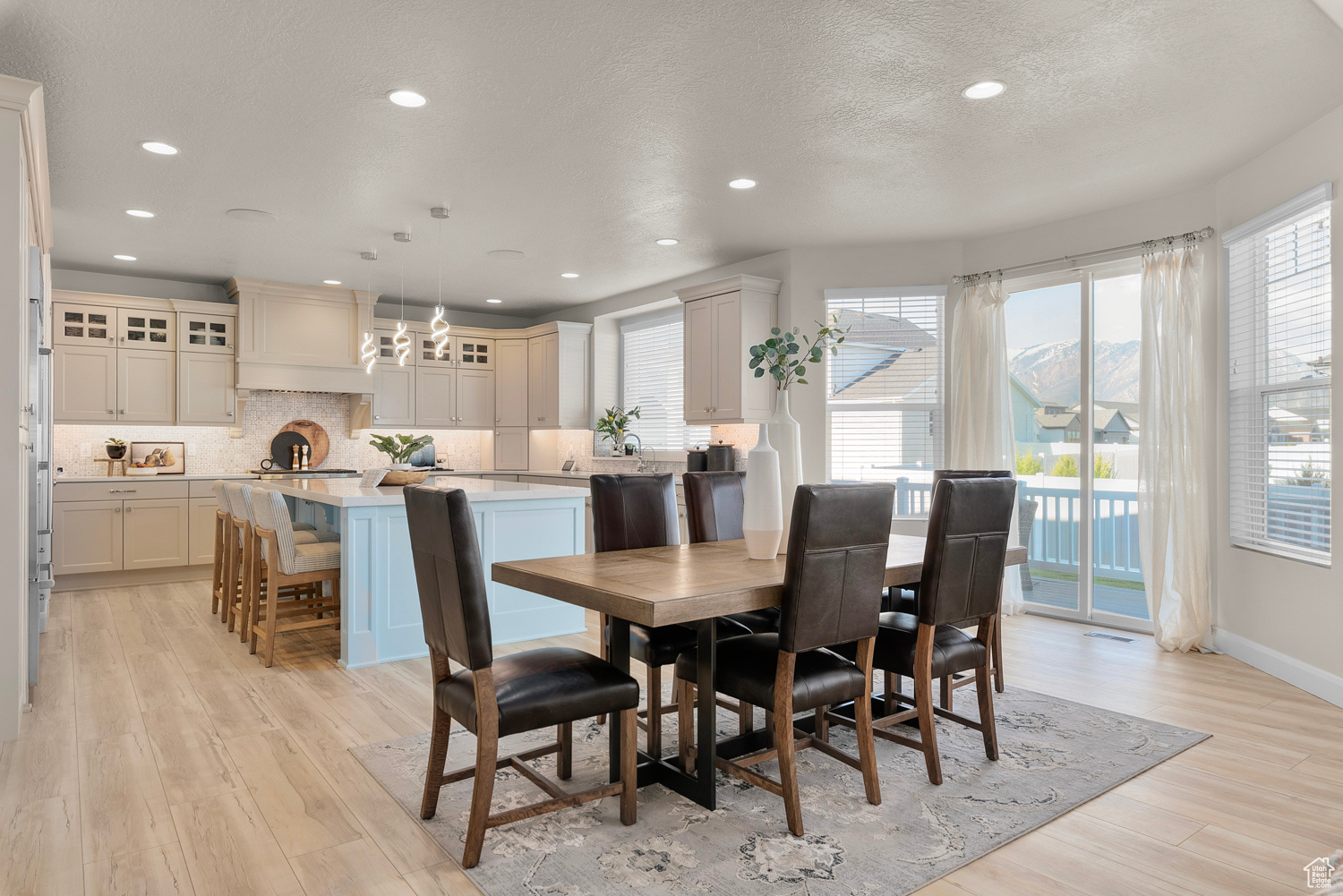 Casual dining space with tons of natural light, sliding glass door out onto deck