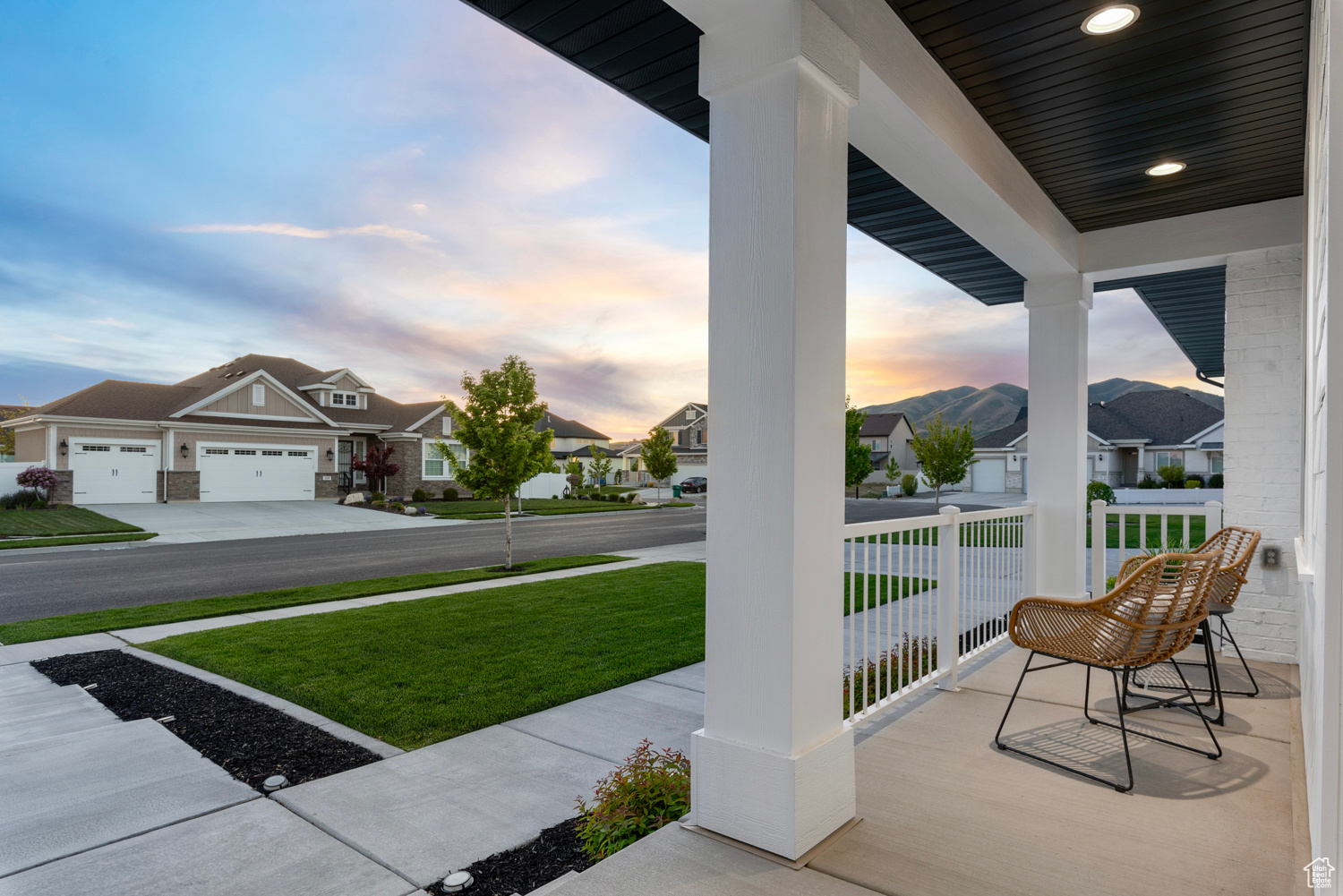 Covered front porch at dusk facing west to enjoy stunning sunsets