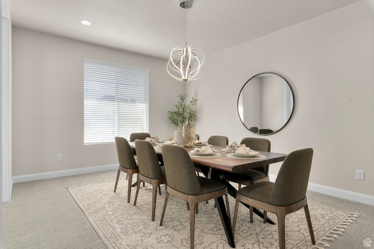 Formal dining room with brand new carpet, butler's pantry is adjacent with storage, and Sub-Zero beverage cooler and ice maker