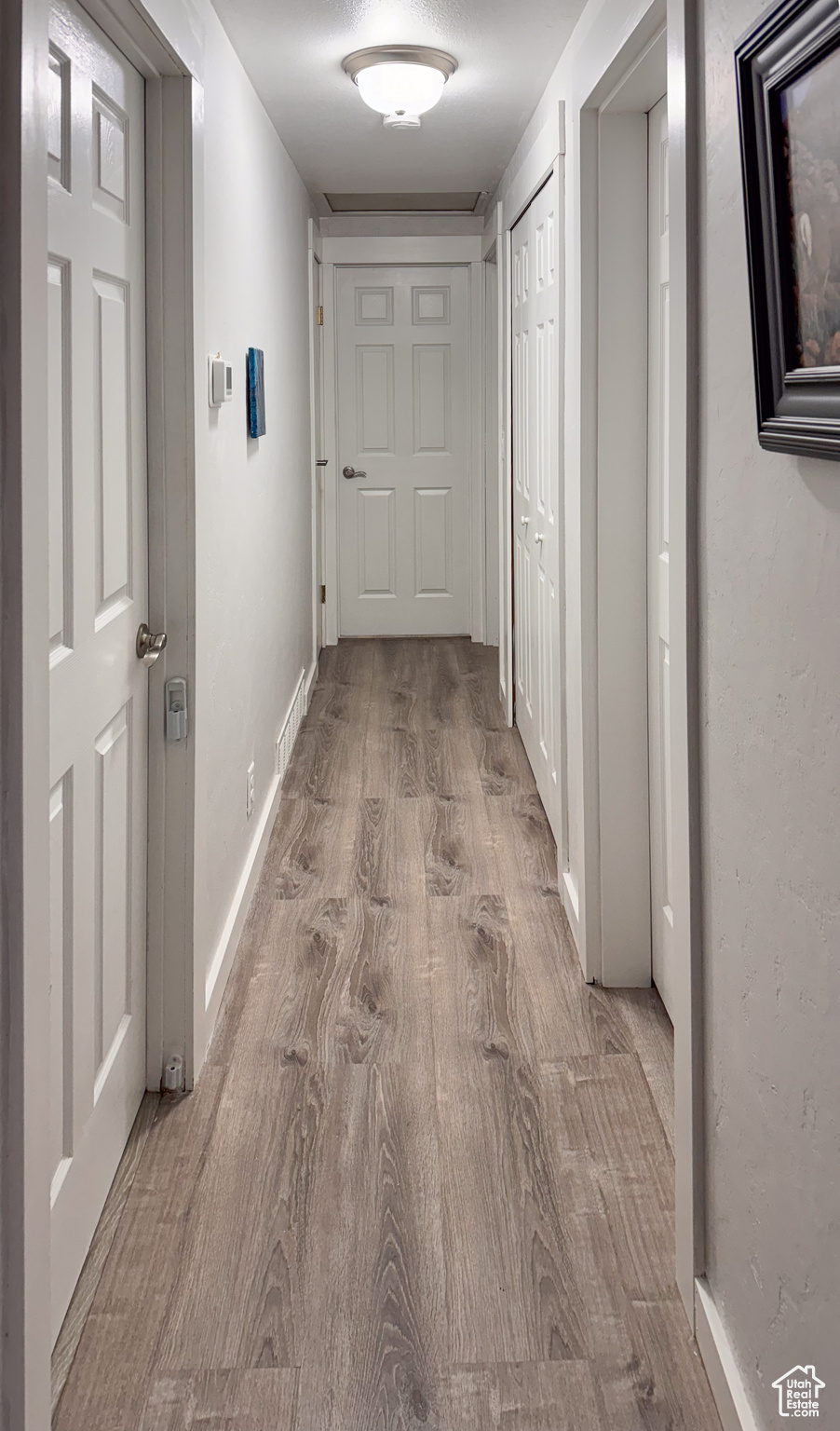 Hallway featuring hardwood / wood-style flooring