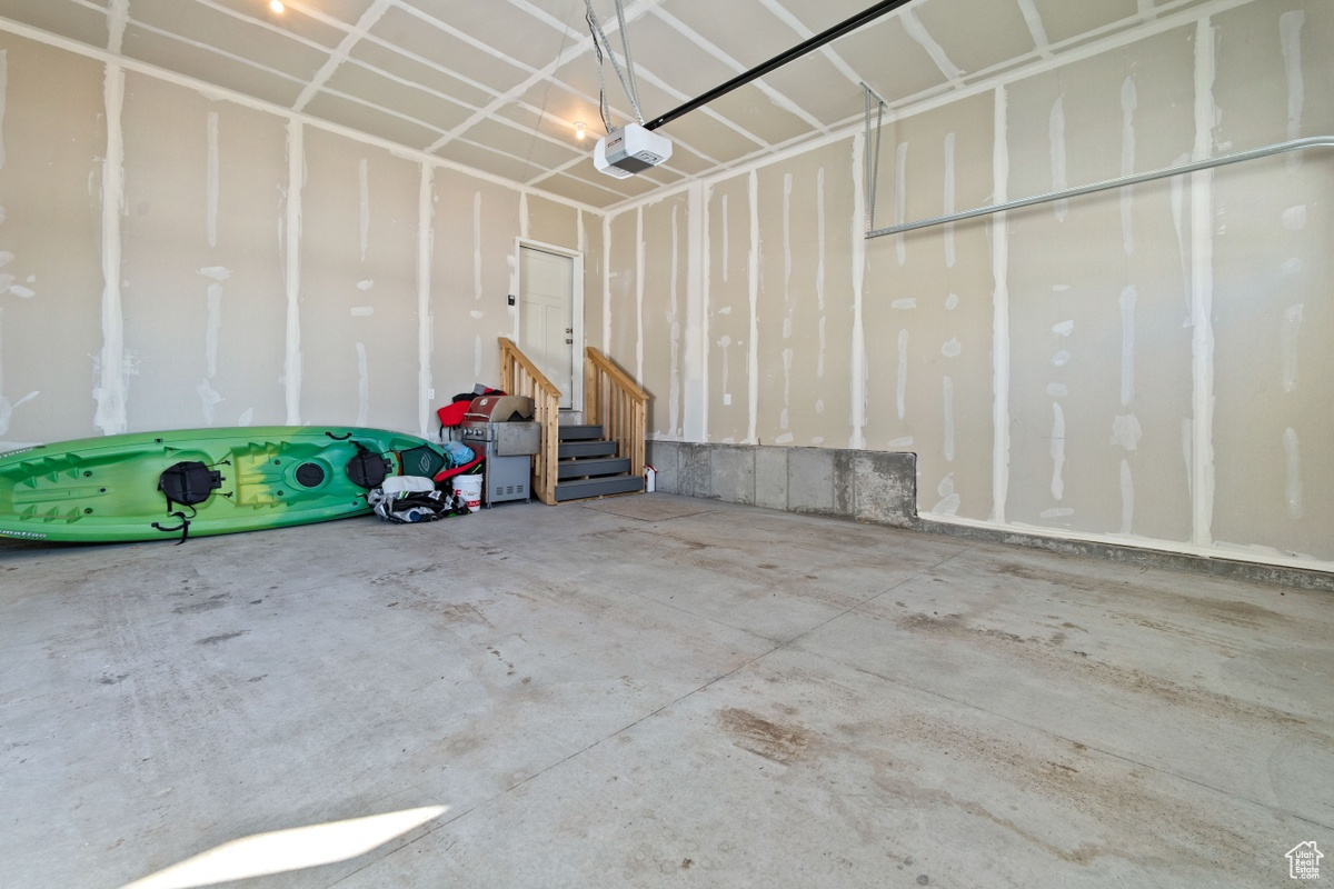 Garage featuring a garage door opener