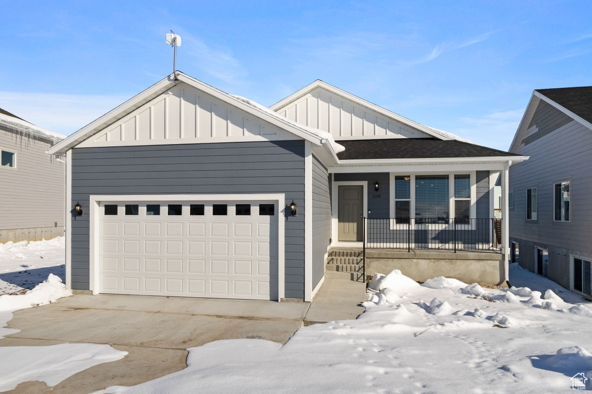 View of front of property with a garage