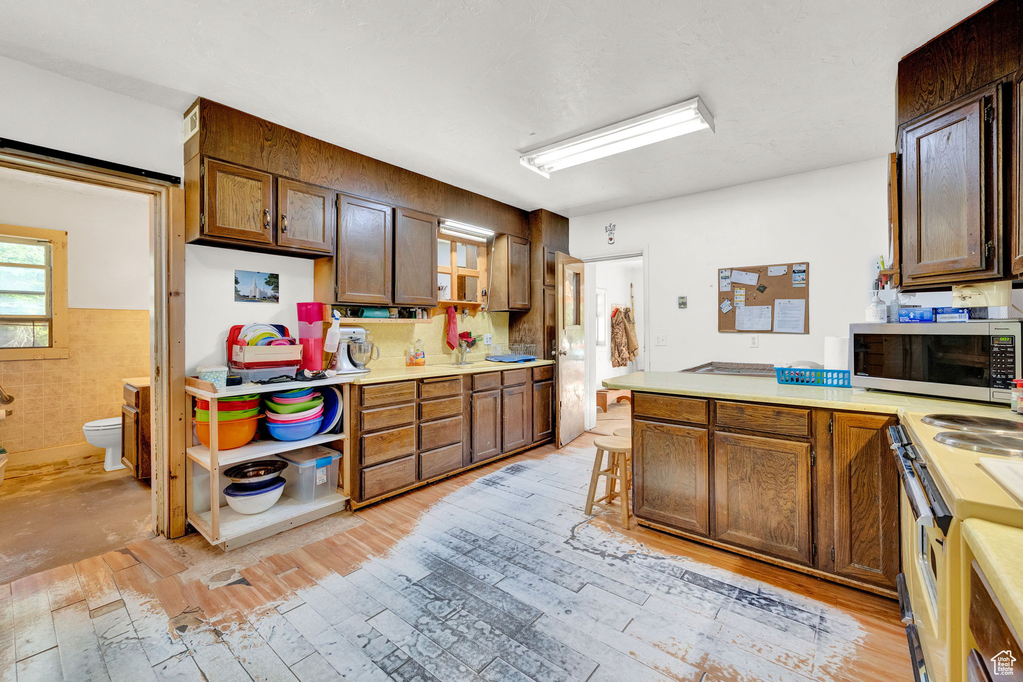 Kitchen with wood-style floors and appliances