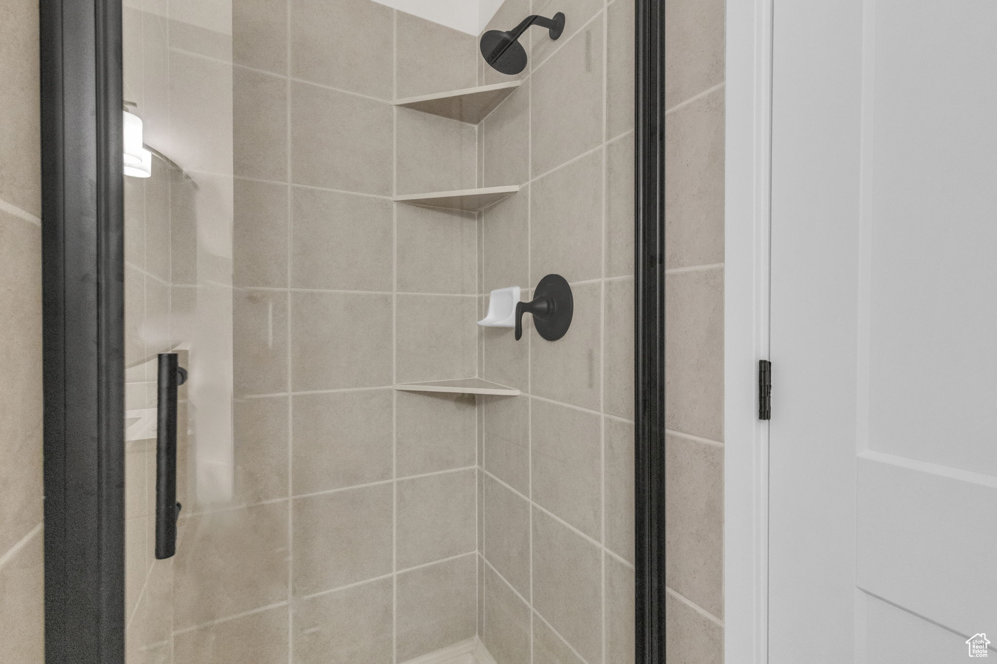 Bathroom with a shower with shower door