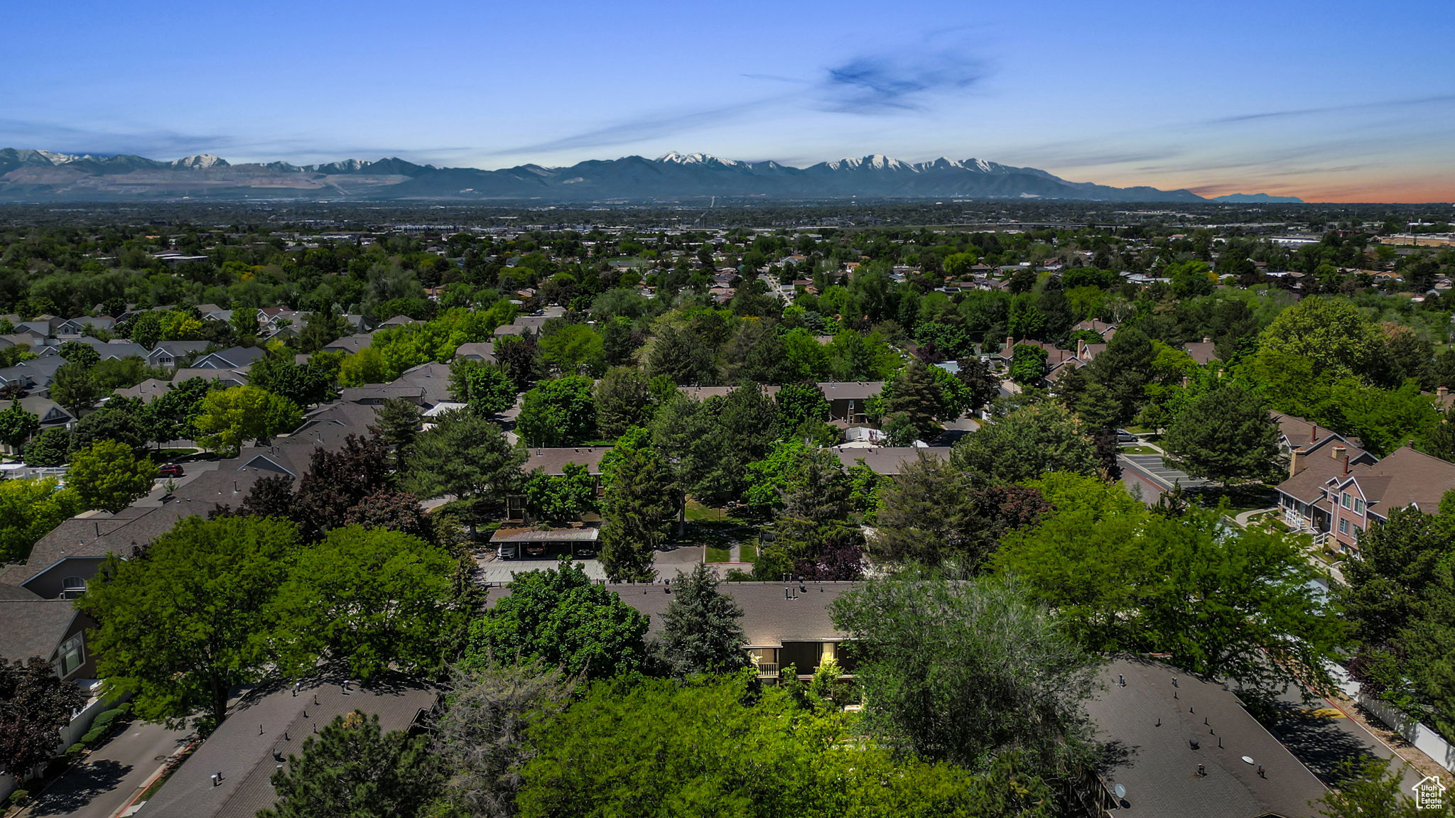 Aerial view at dusk featuring a mountain view