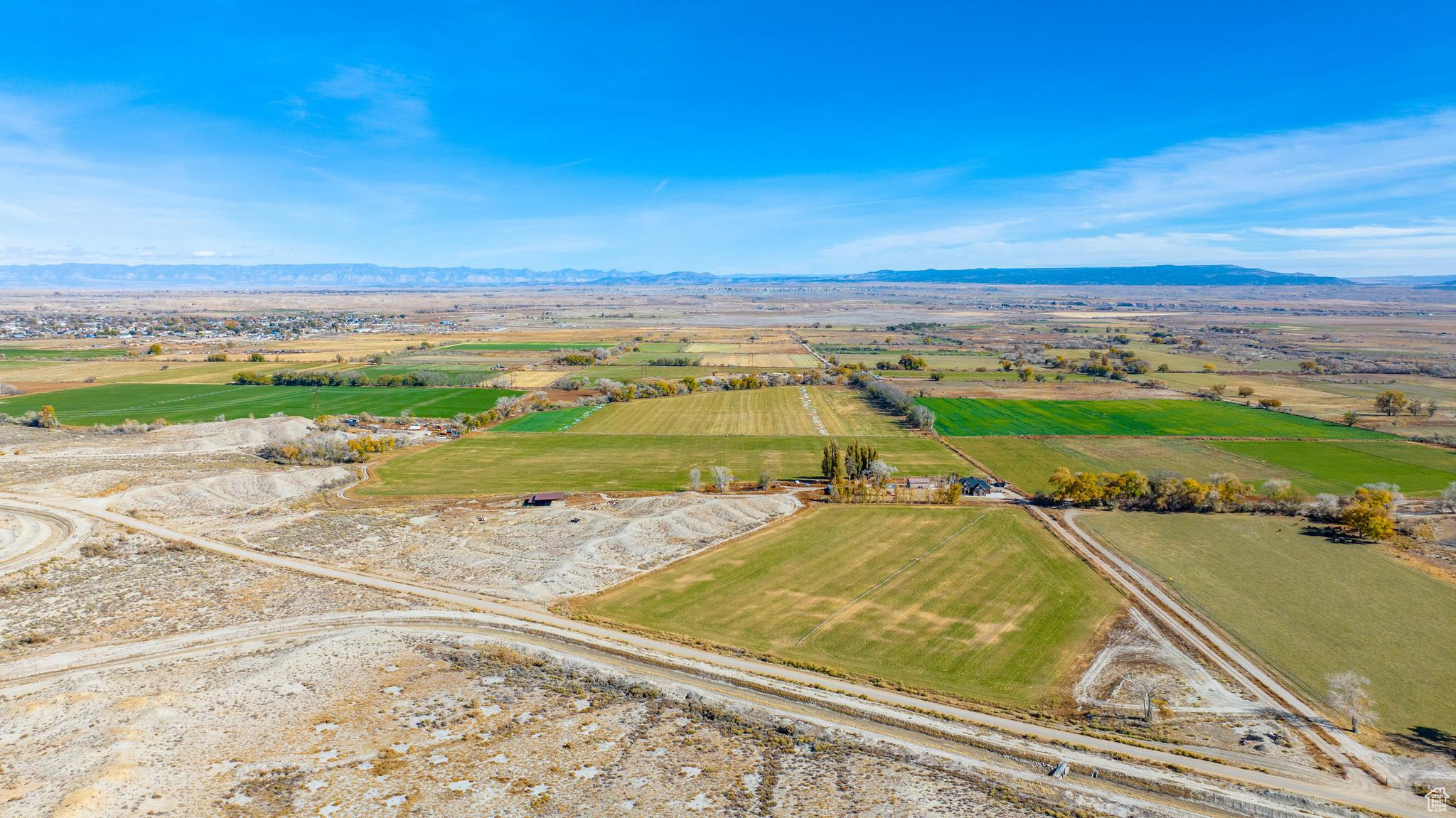 Birds eye view of property with a rural view