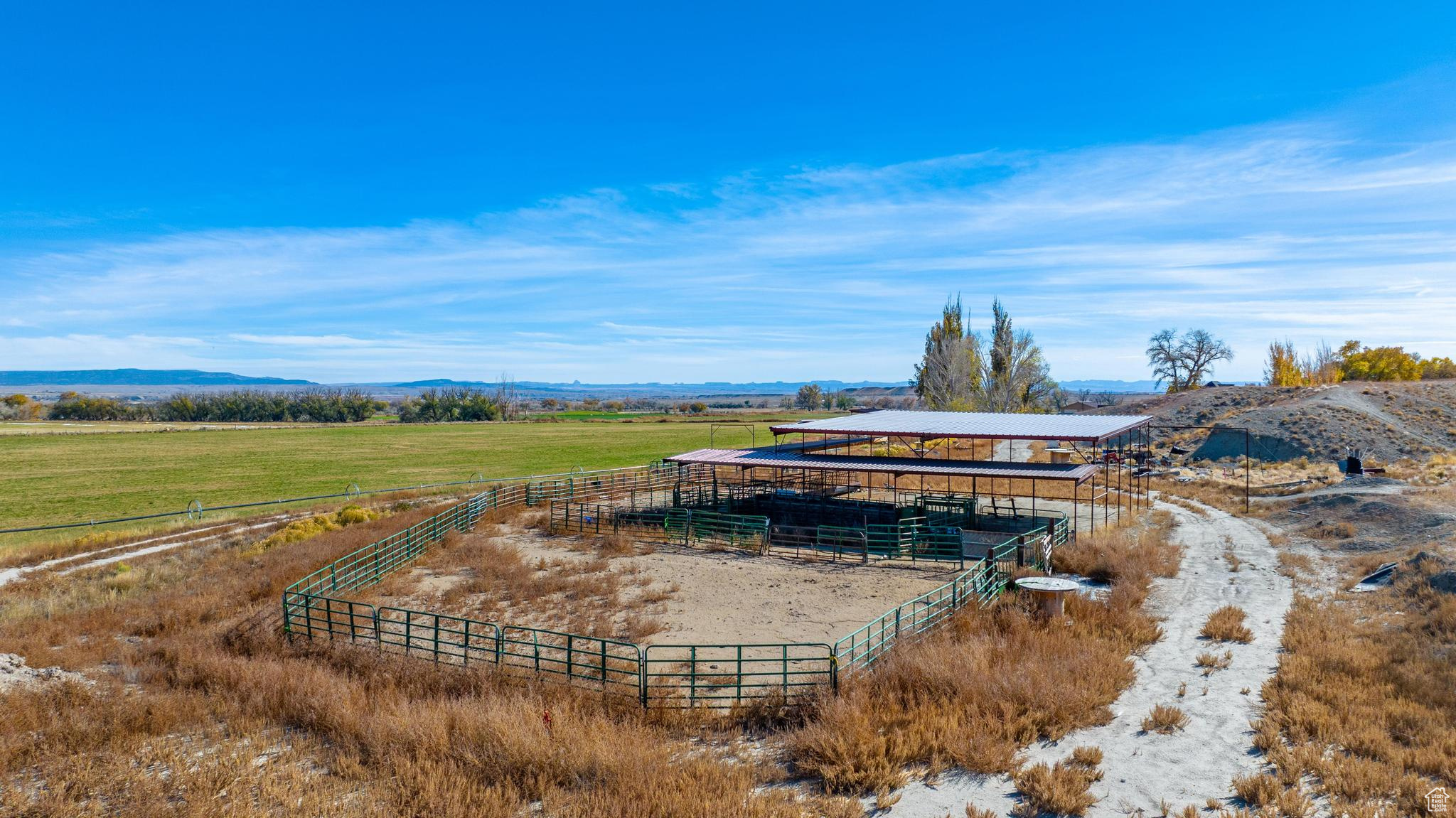 Exterior space featuring a rural view.  Horse and/or cattle corral.