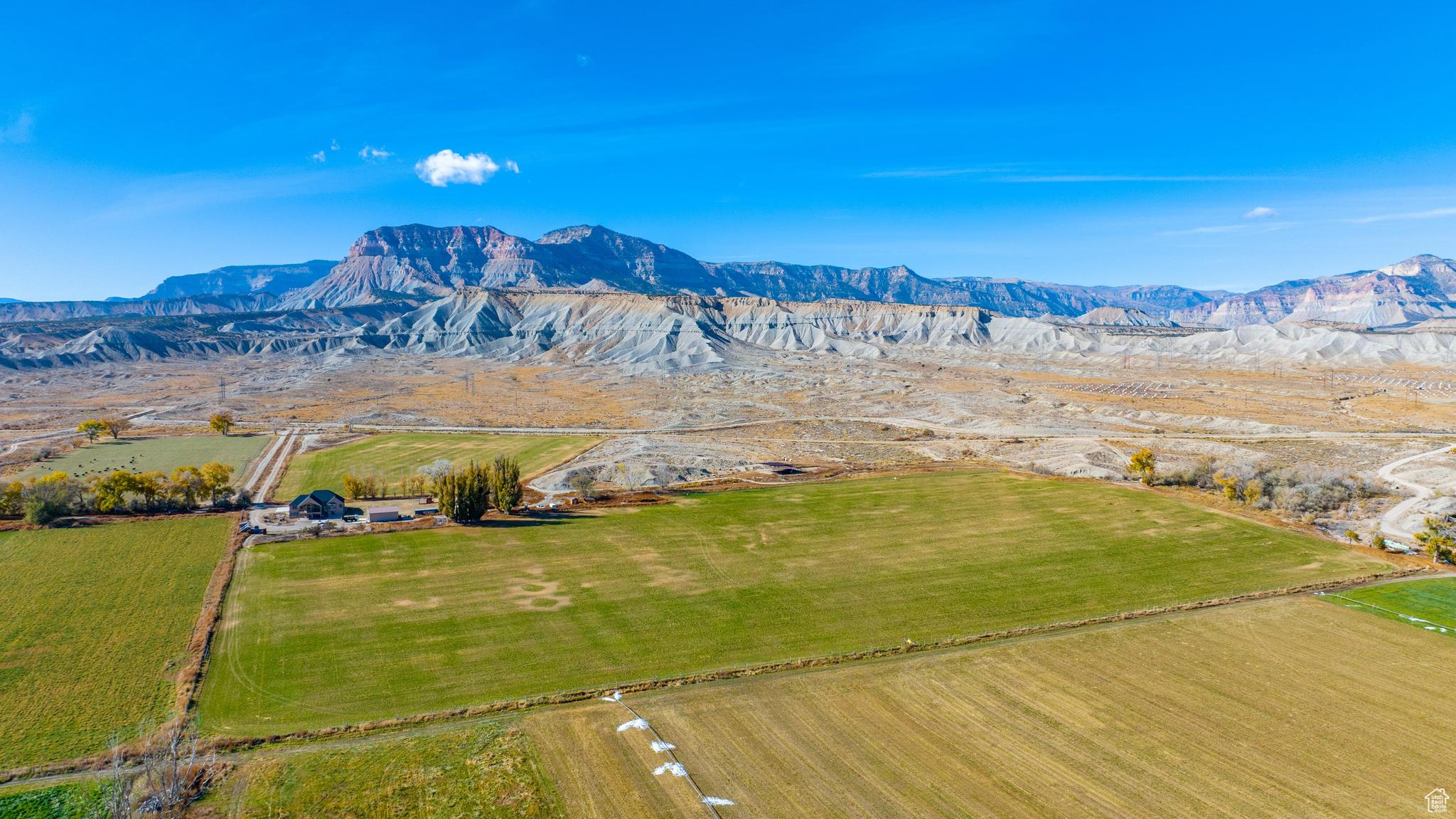 Exterior space featuring a rural view and a mountain view.  Working farm alpha hay parcel.