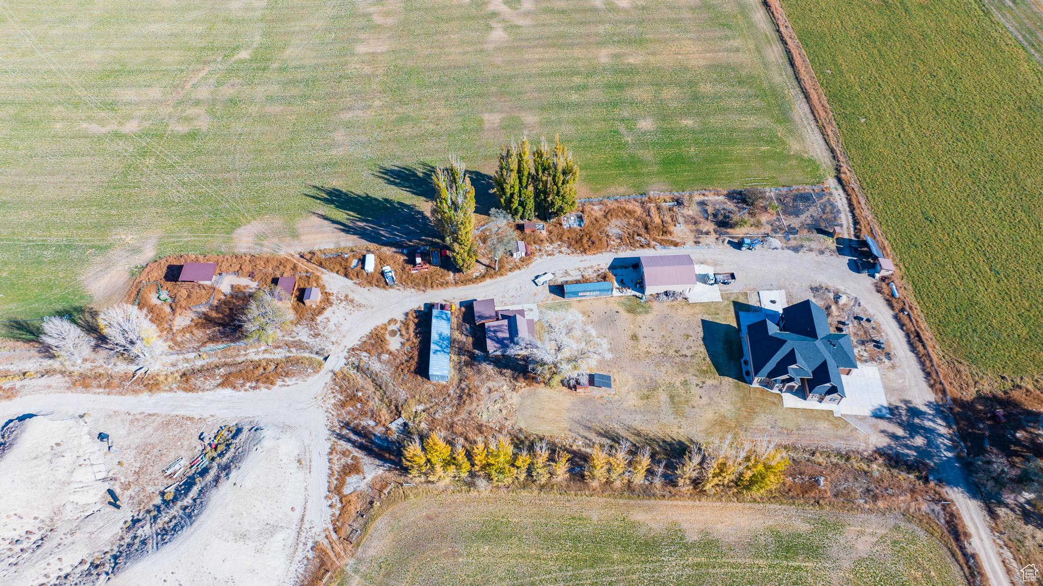 Birds eye view of property featuring a rural view