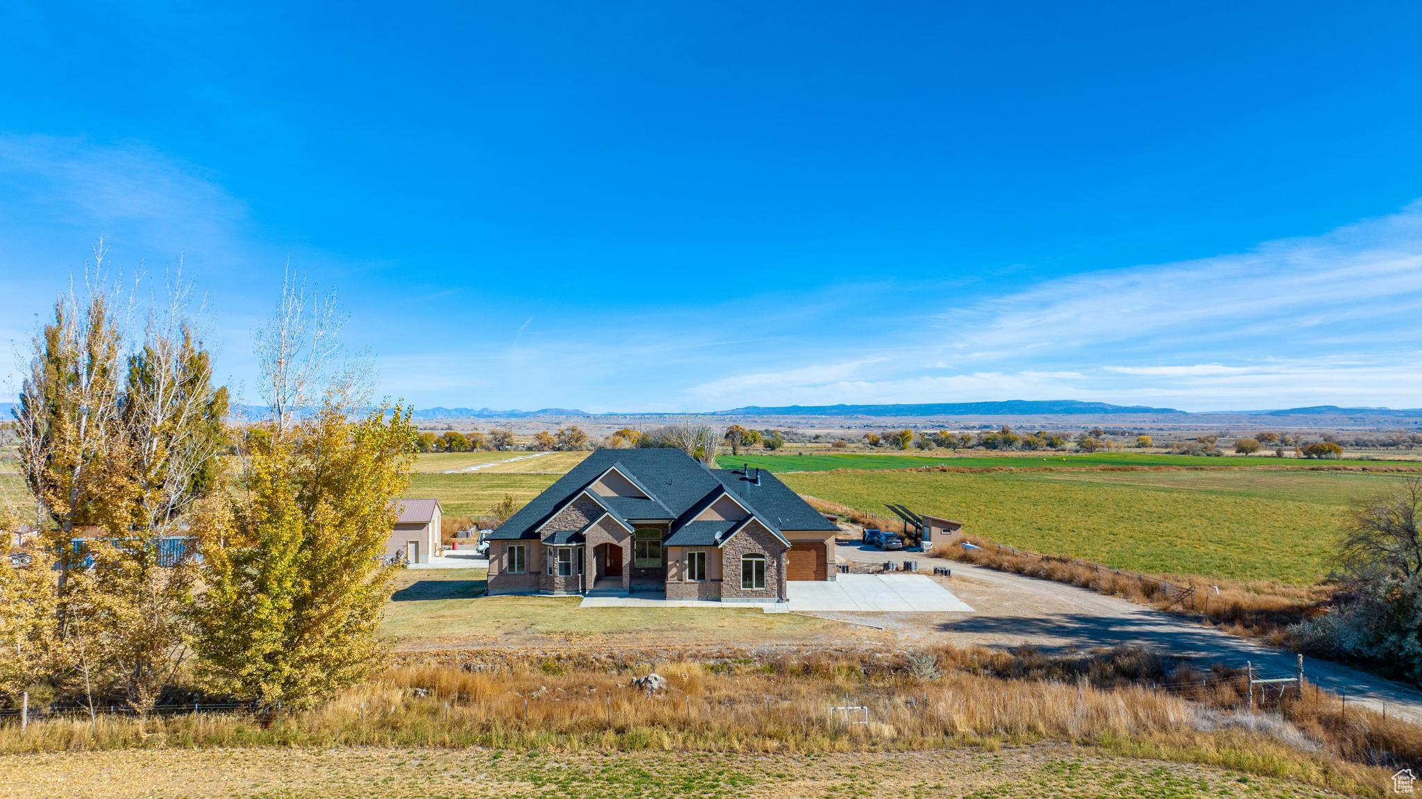 View of front of property with a rural view