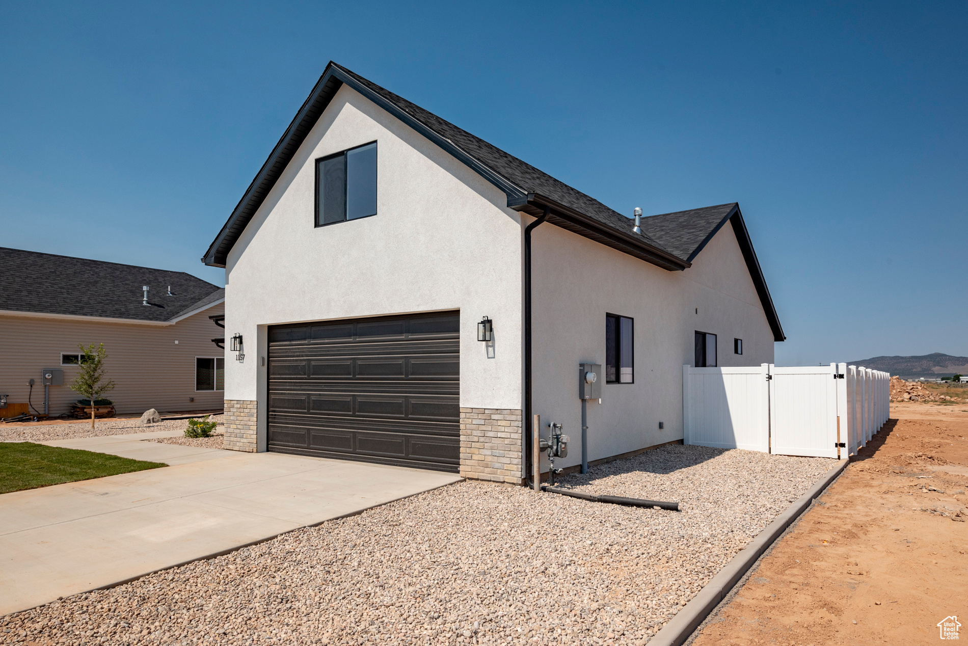 View of side of property featuring a garage