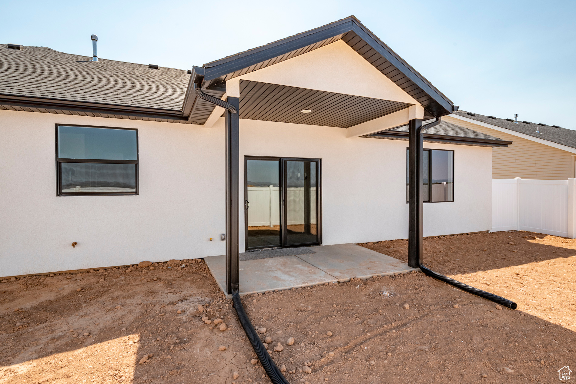 Rear view of property featuring a patio area