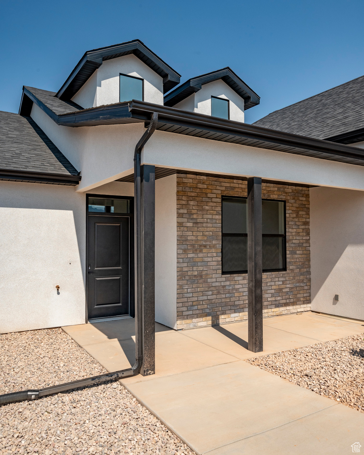 Property entrance with a patio area