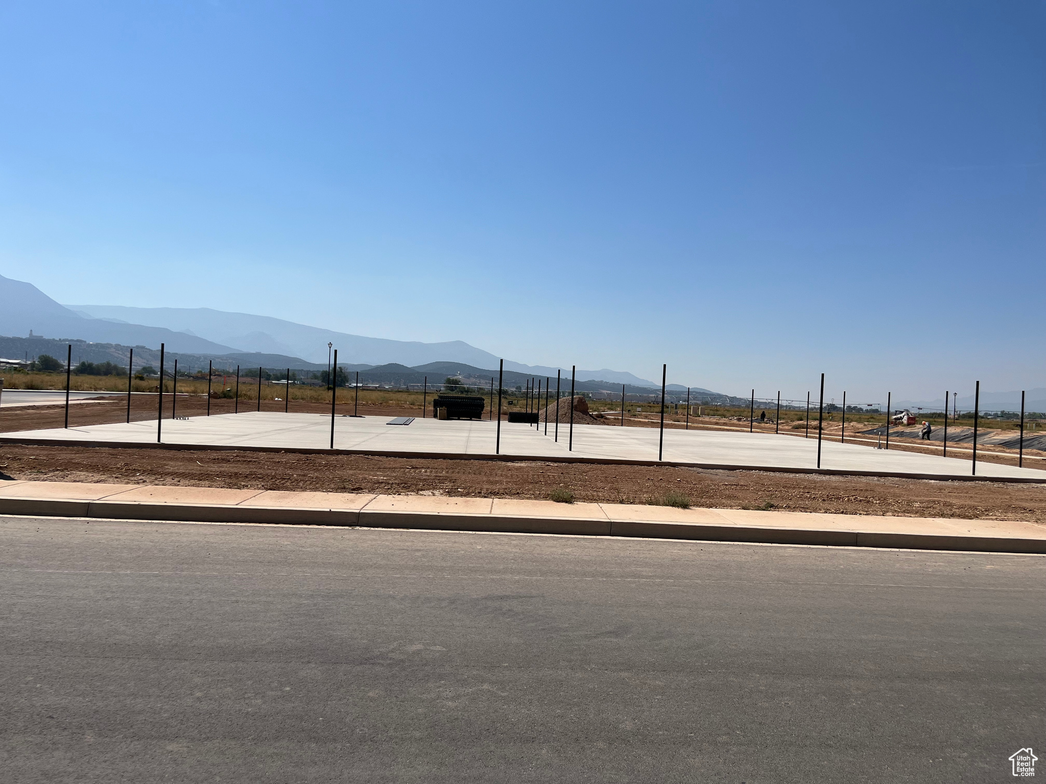 View of yard with tennis court and a mountain view