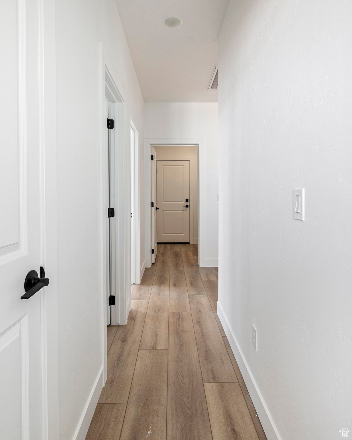 Hallway featuring light hardwood / wood-style floors