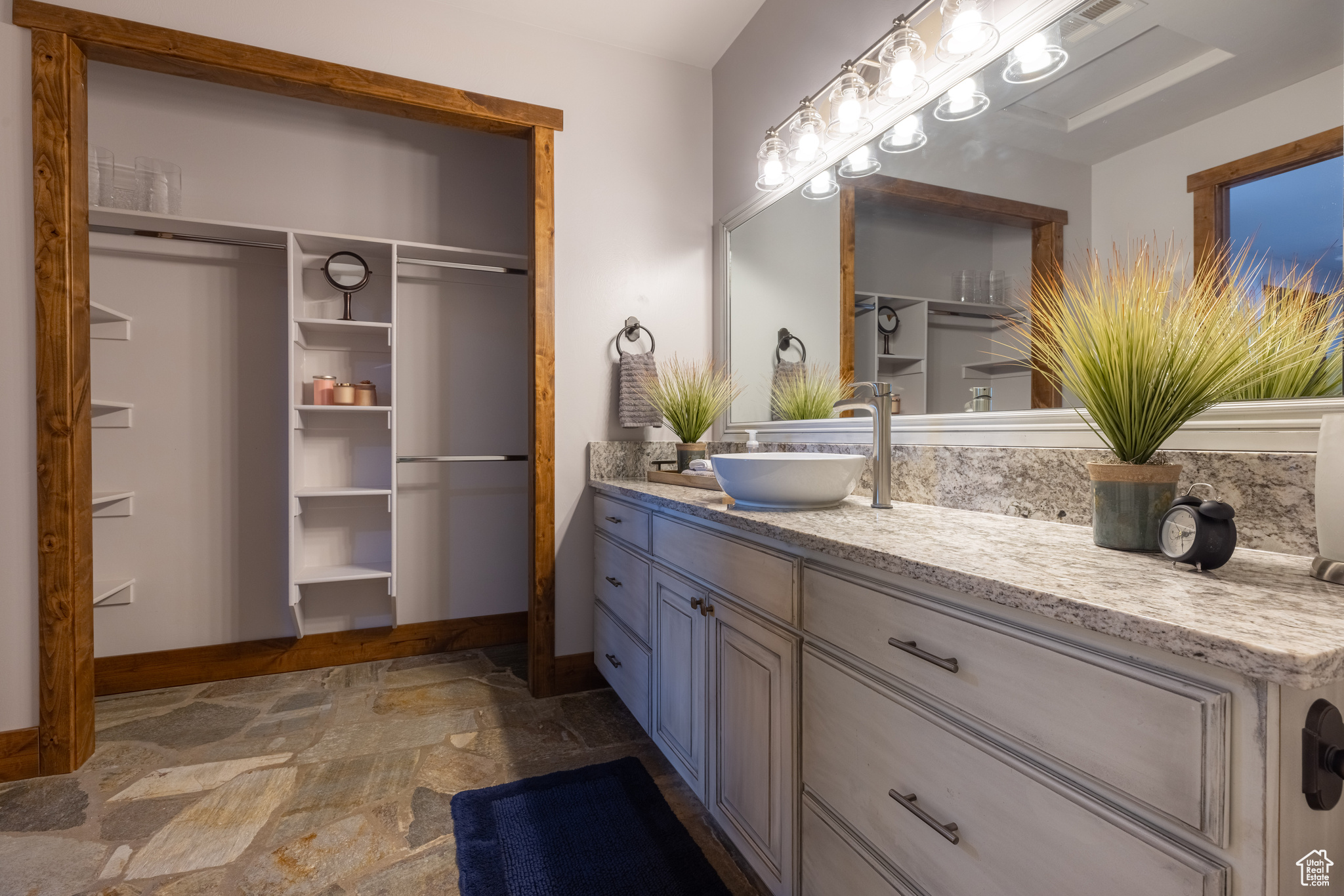 Ensuite Bathroom featuring slate floors and oversized stone vanity