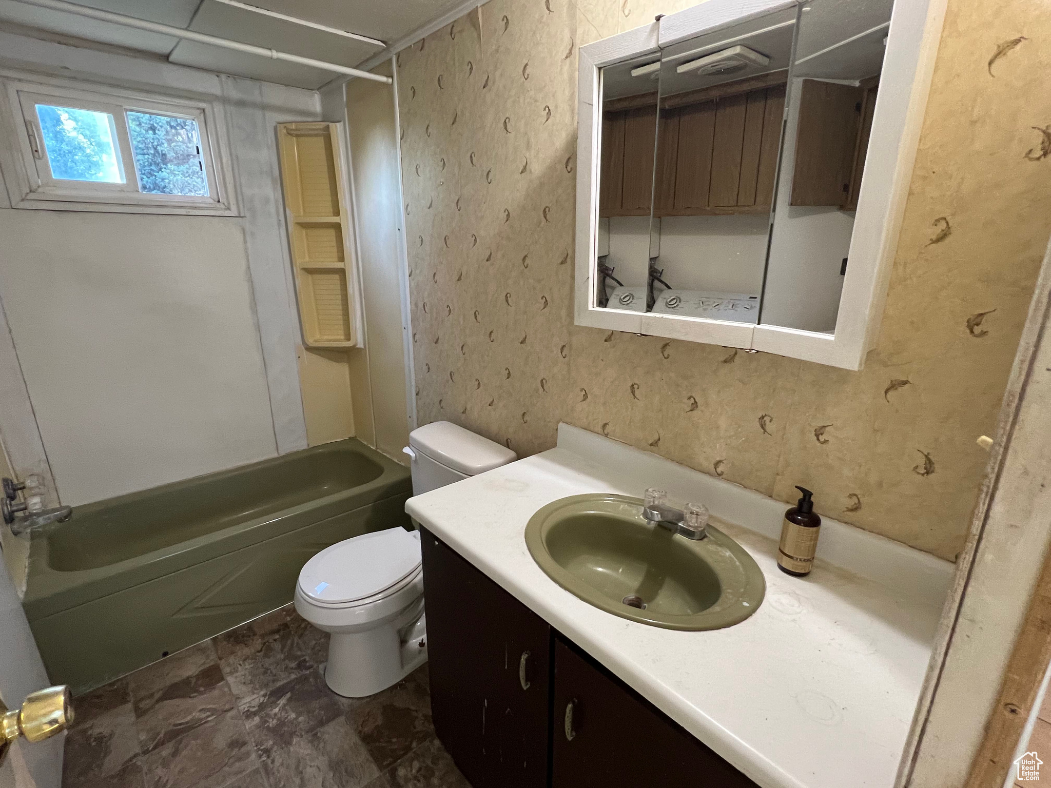 Full bathroom featuring tub / shower combination, toilet, tile floors, and large vanity