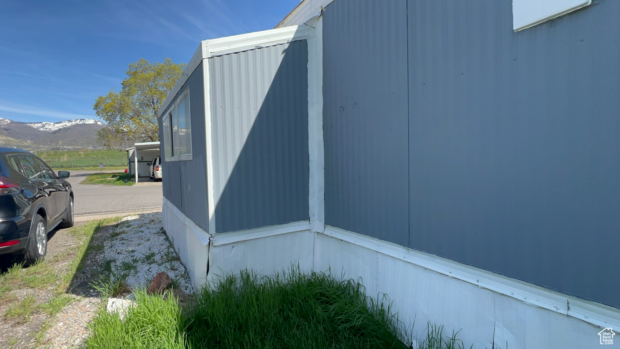 View of side of property with a mountain view