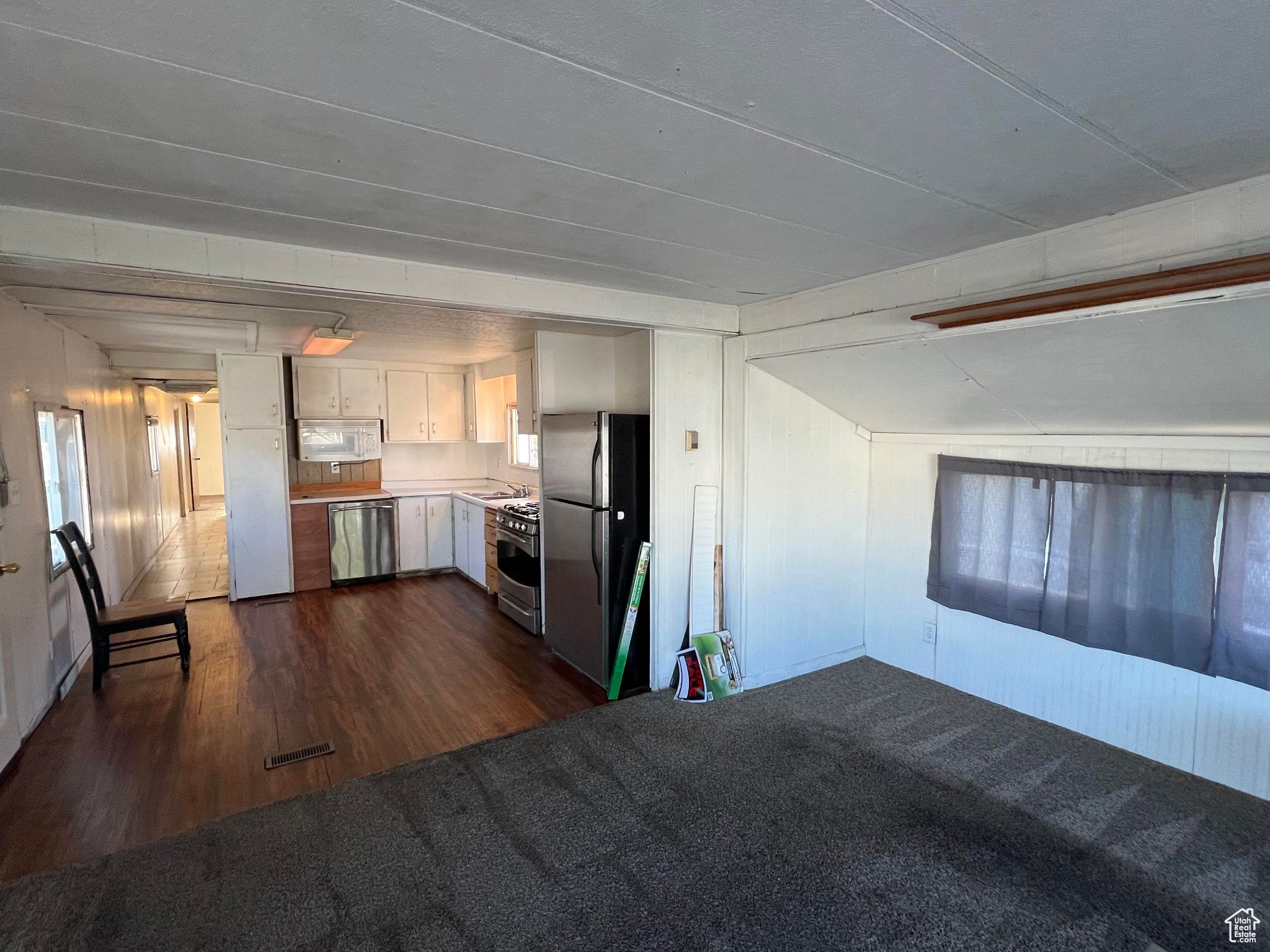 Interior space with dark hardwood / wood-style flooring