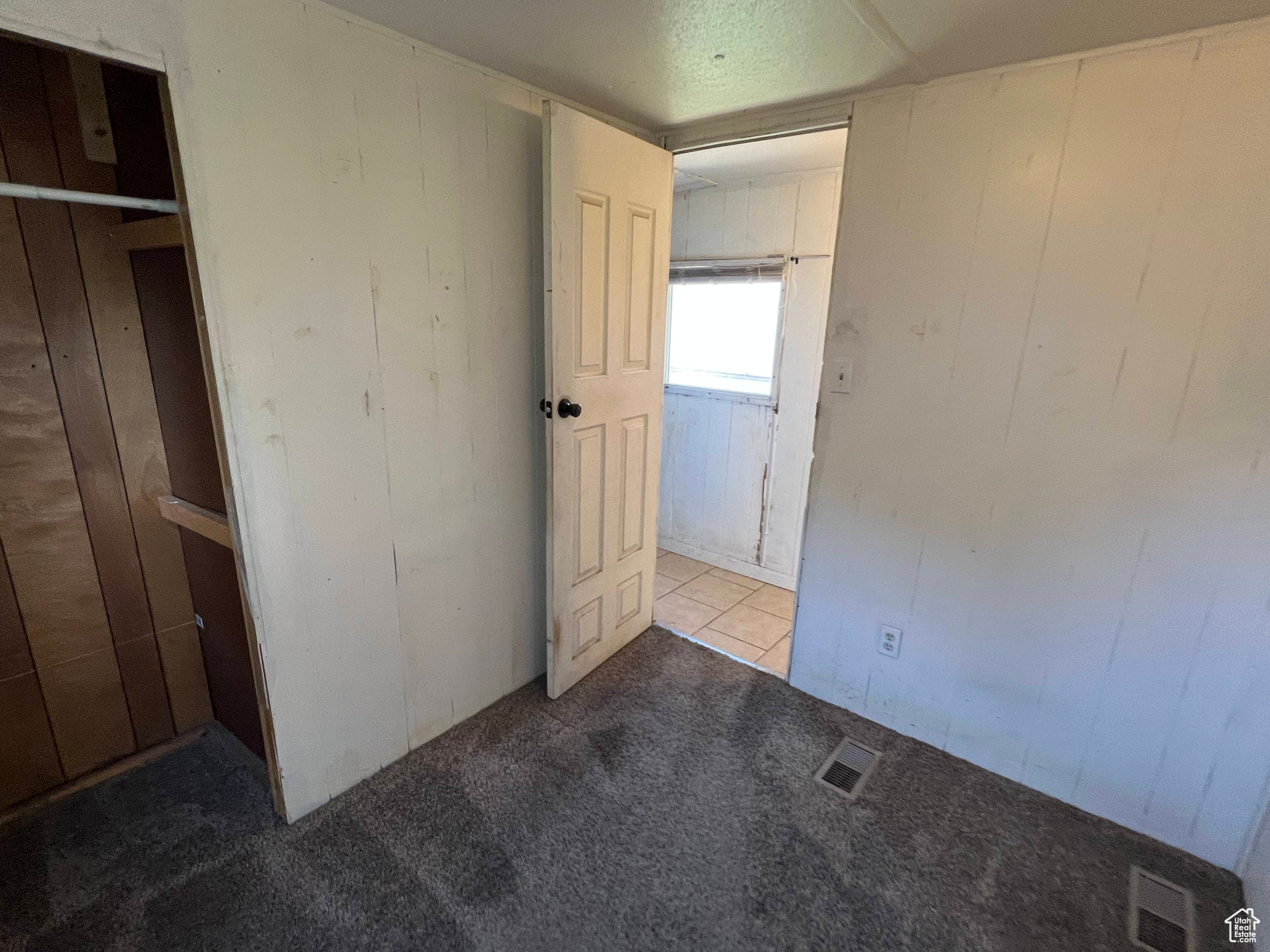 Unfurnished bedroom featuring carpet floors