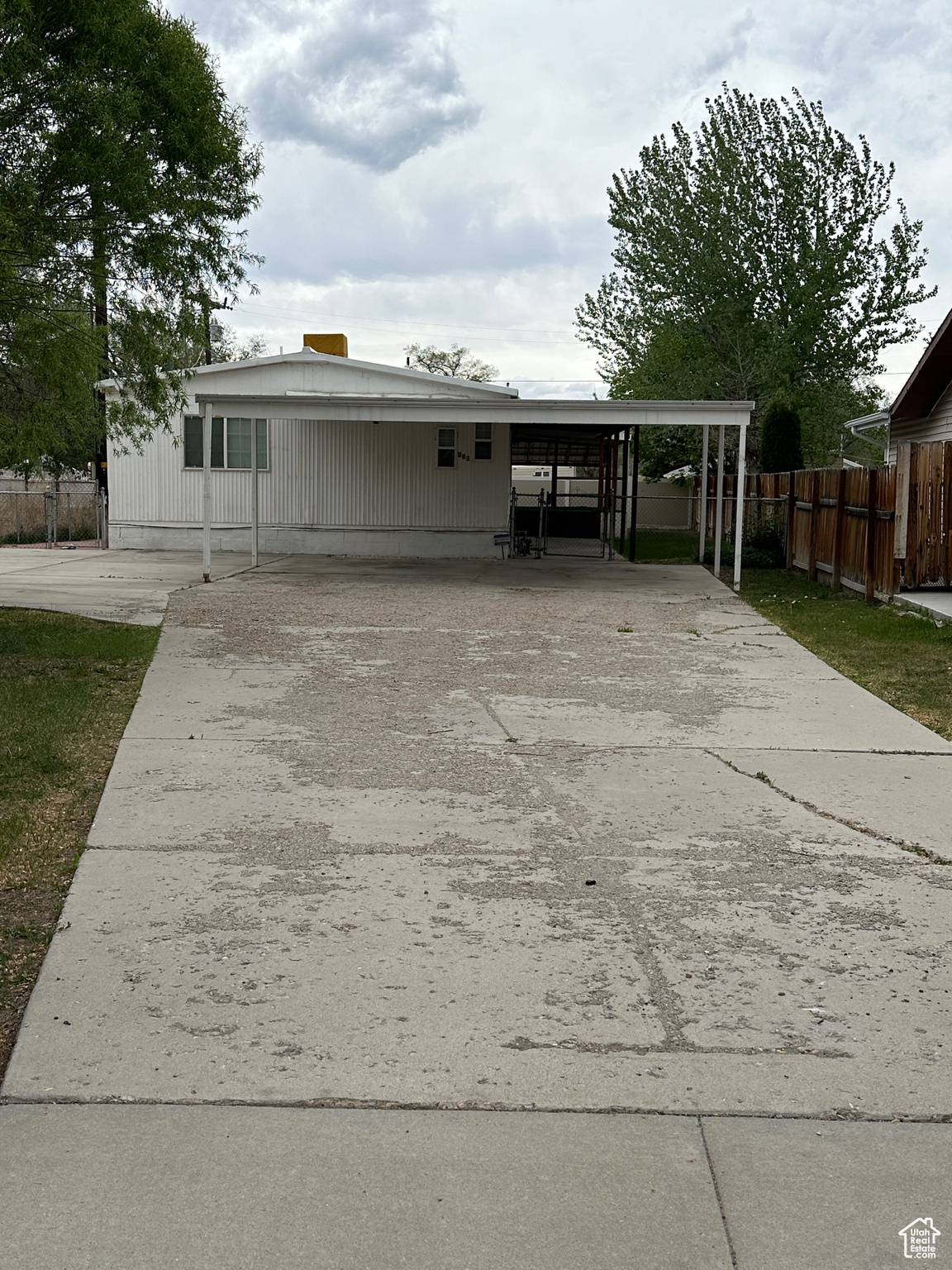 View of front of house with a carport