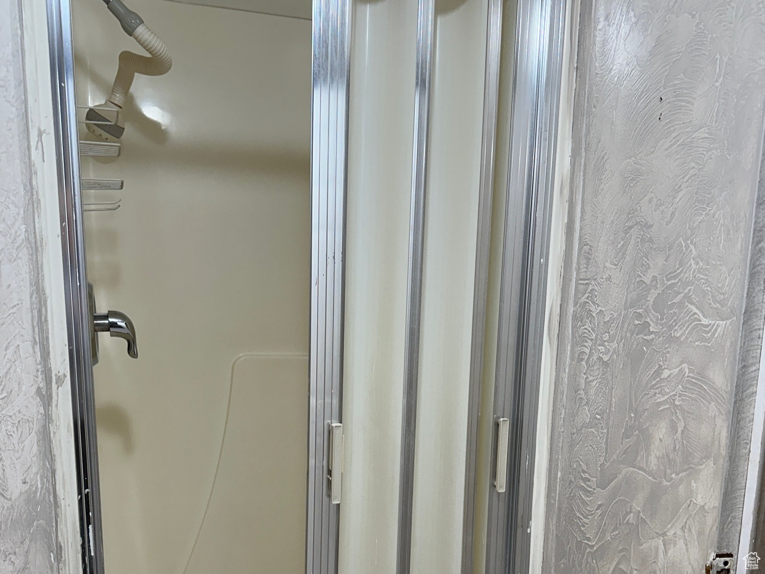 Bathroom with a shower with door