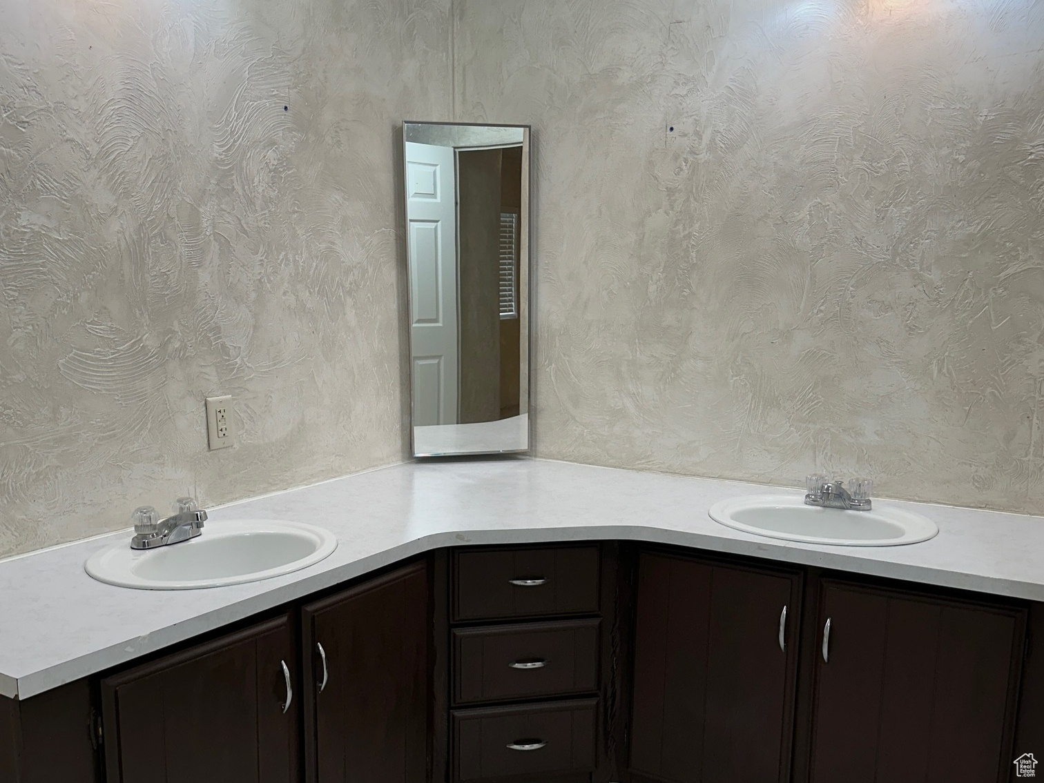 Bathroom featuring double vanity and tile flooring