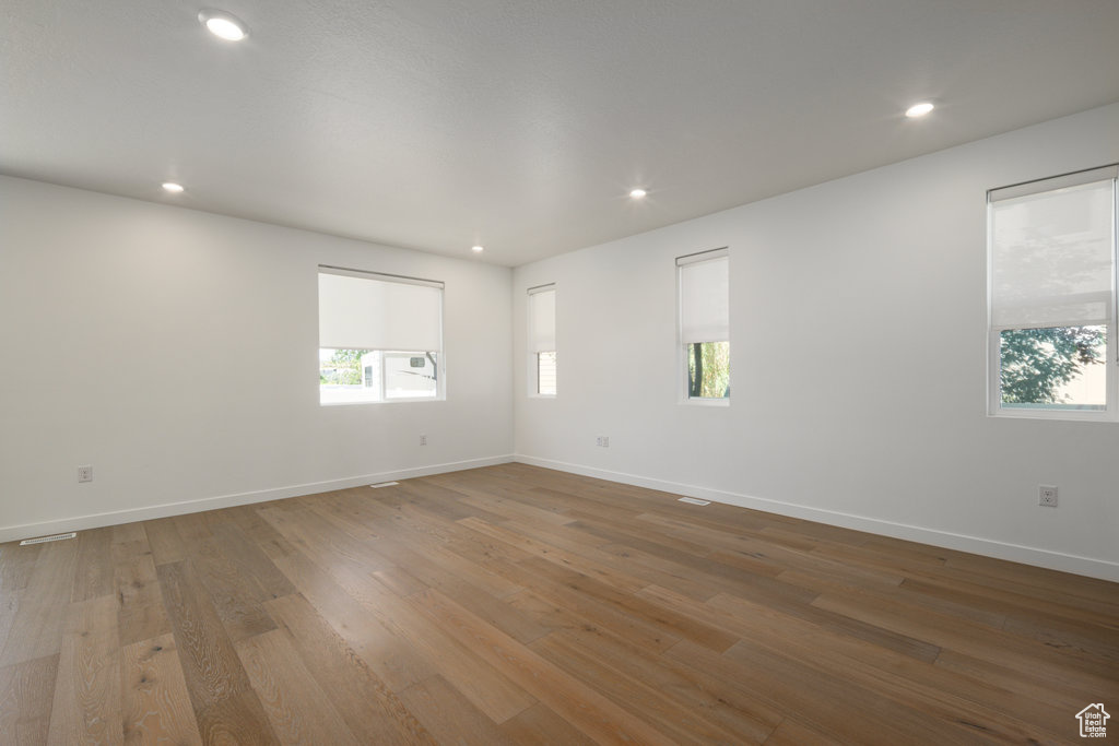 Spare room featuring hardwood / wood-style floors