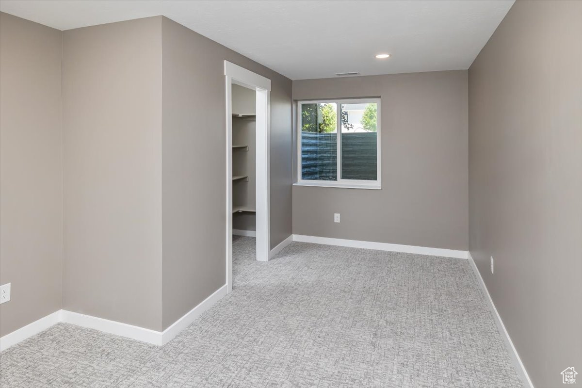 Empty room with carpet flooring