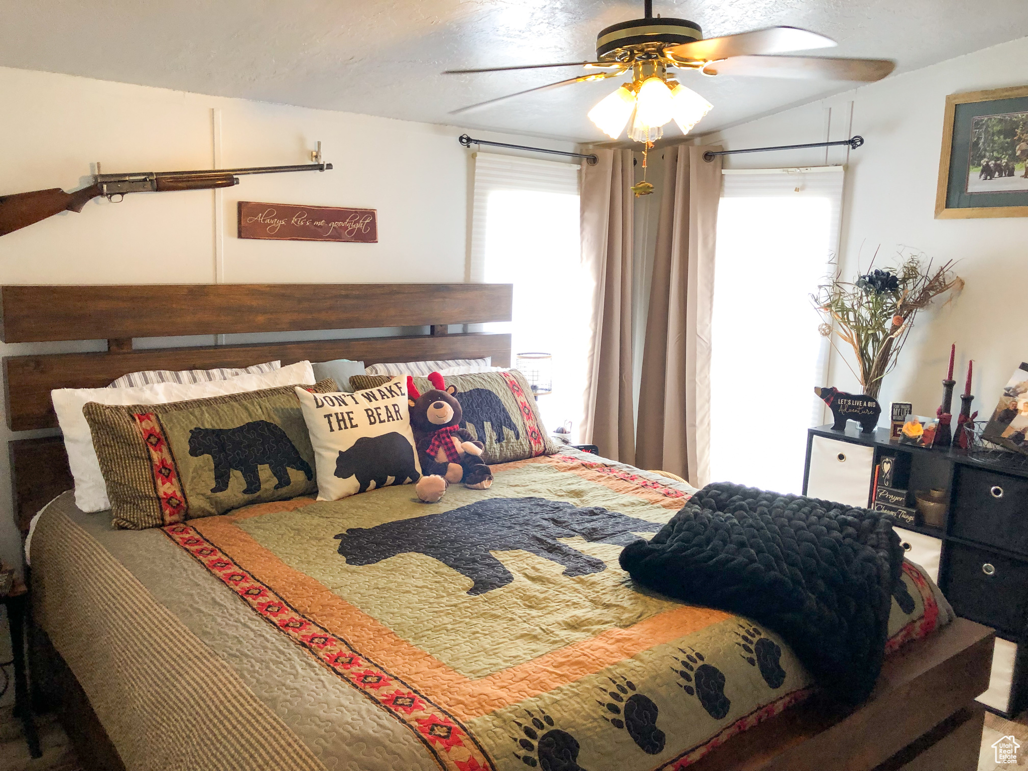 Primary Bedroom featuring ceiling fan and lofted ceiling