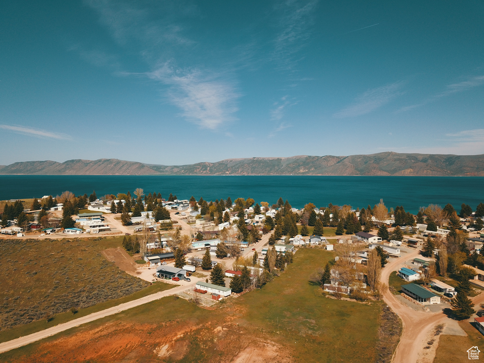 Aerial view of the lake just over the hill with a mountain view