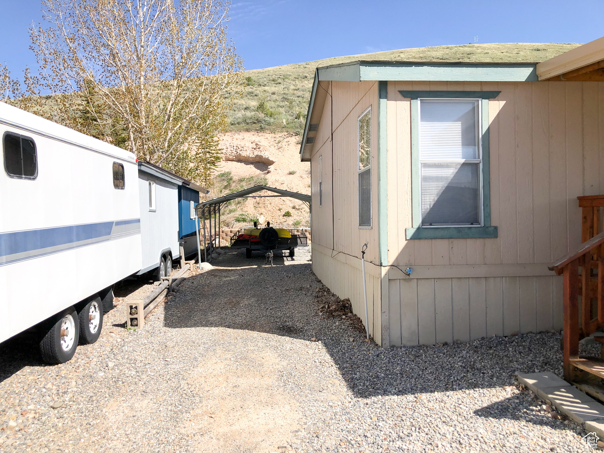 View of home's driveway and covered parking