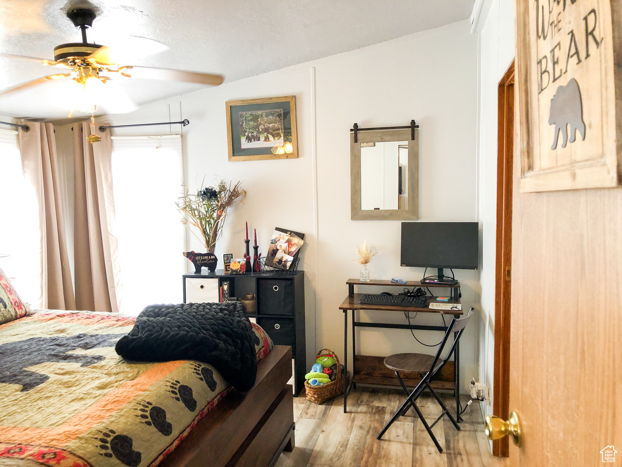 Primary Bedroom featuring ceiling fan and hardwood / wood-style floors