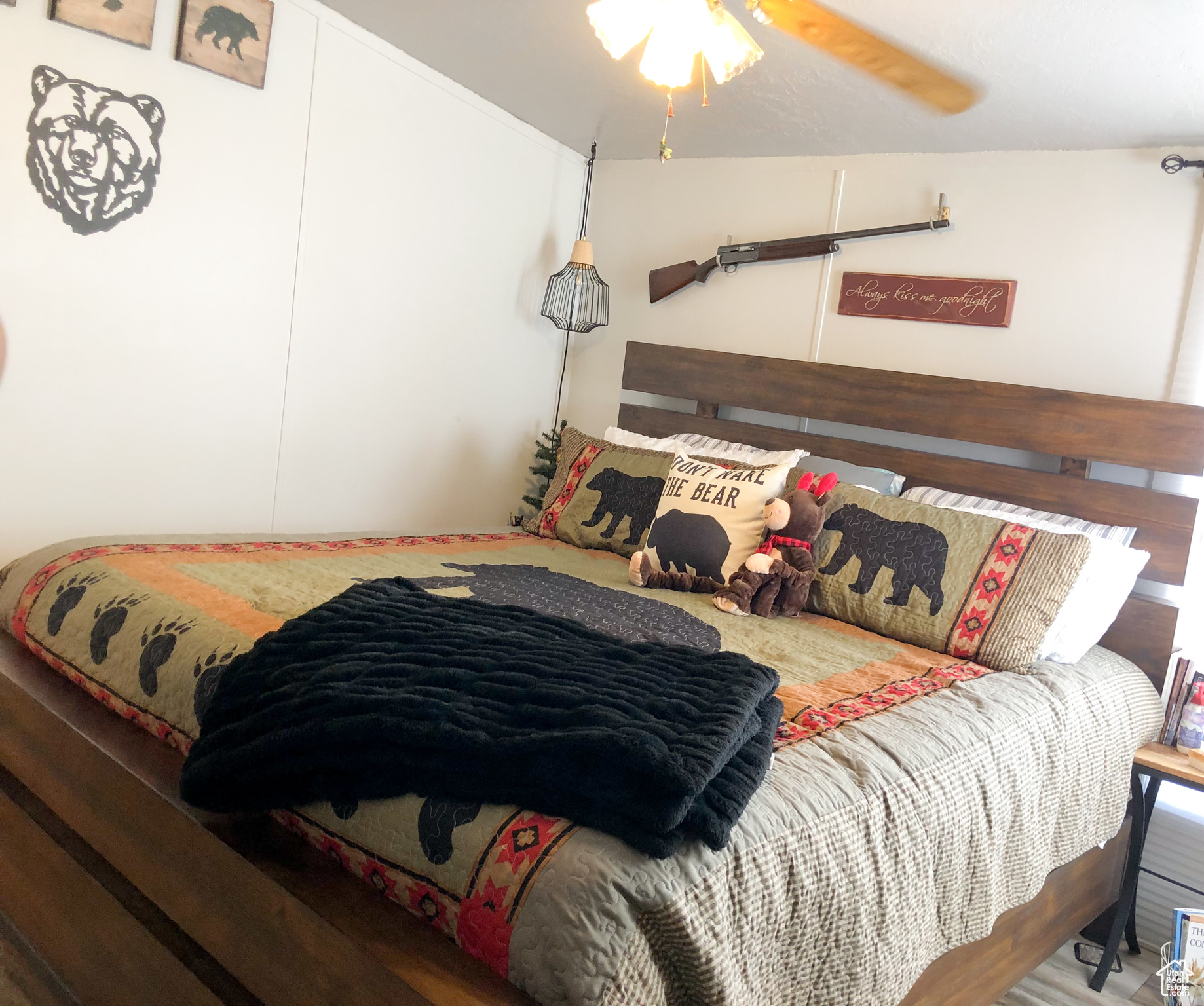 Primary Bedroom with wood-type flooring and ceiling fan