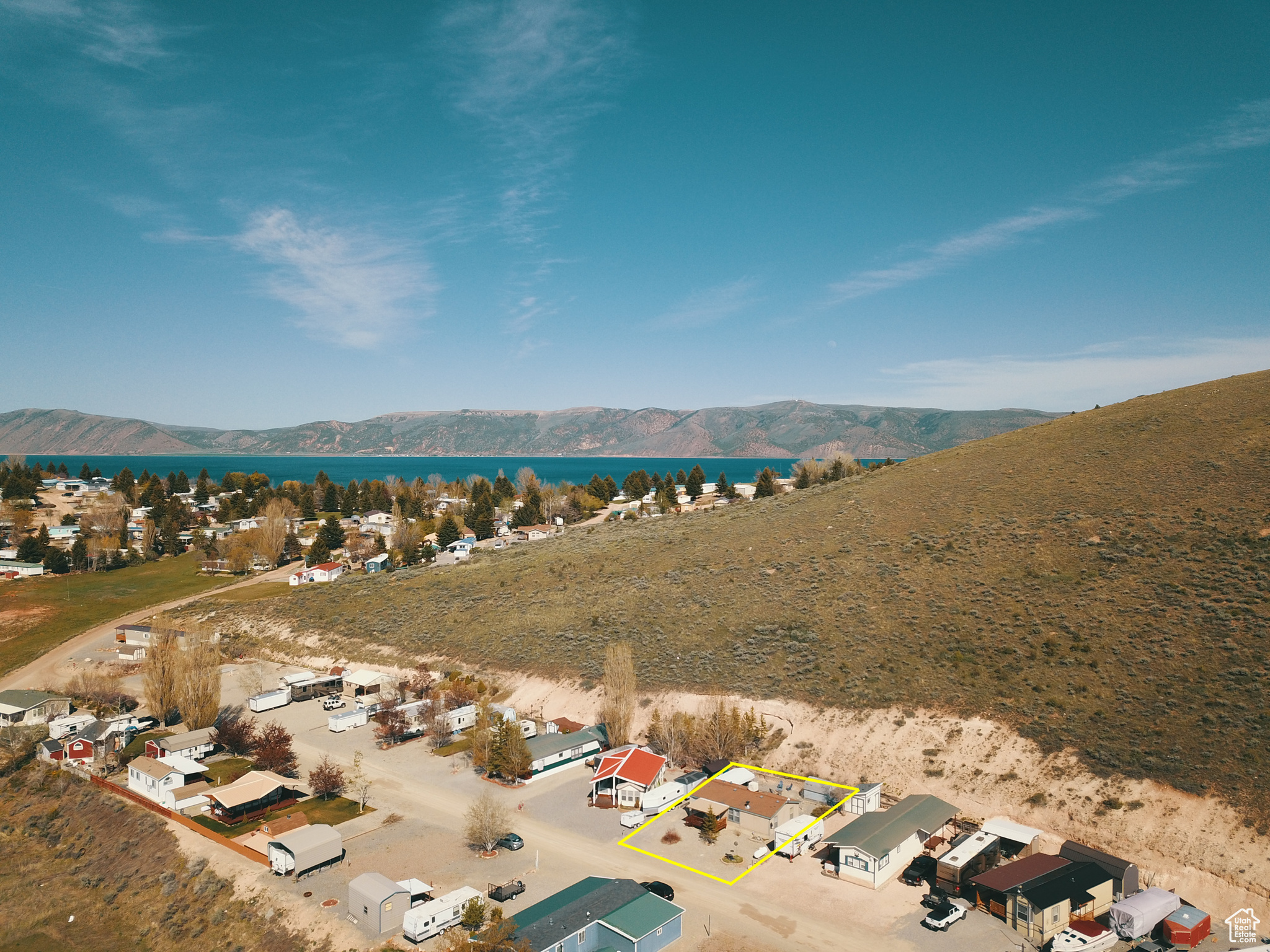 Aerial view of property and lake just over the hill