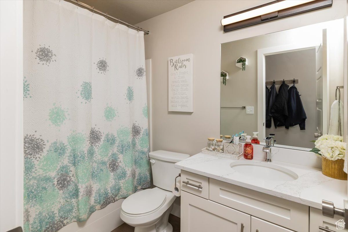 Bathroom with toilet and large vanity