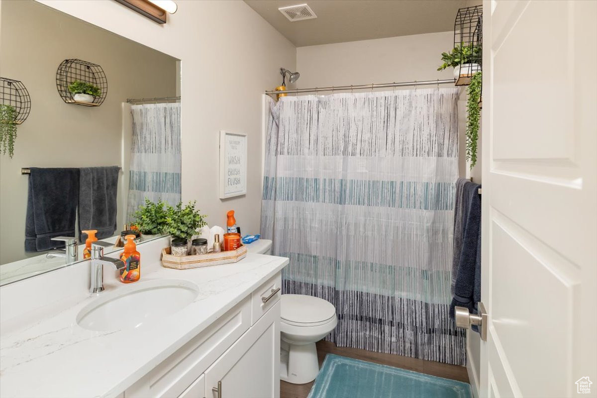 Bathroom with vanity and toilet