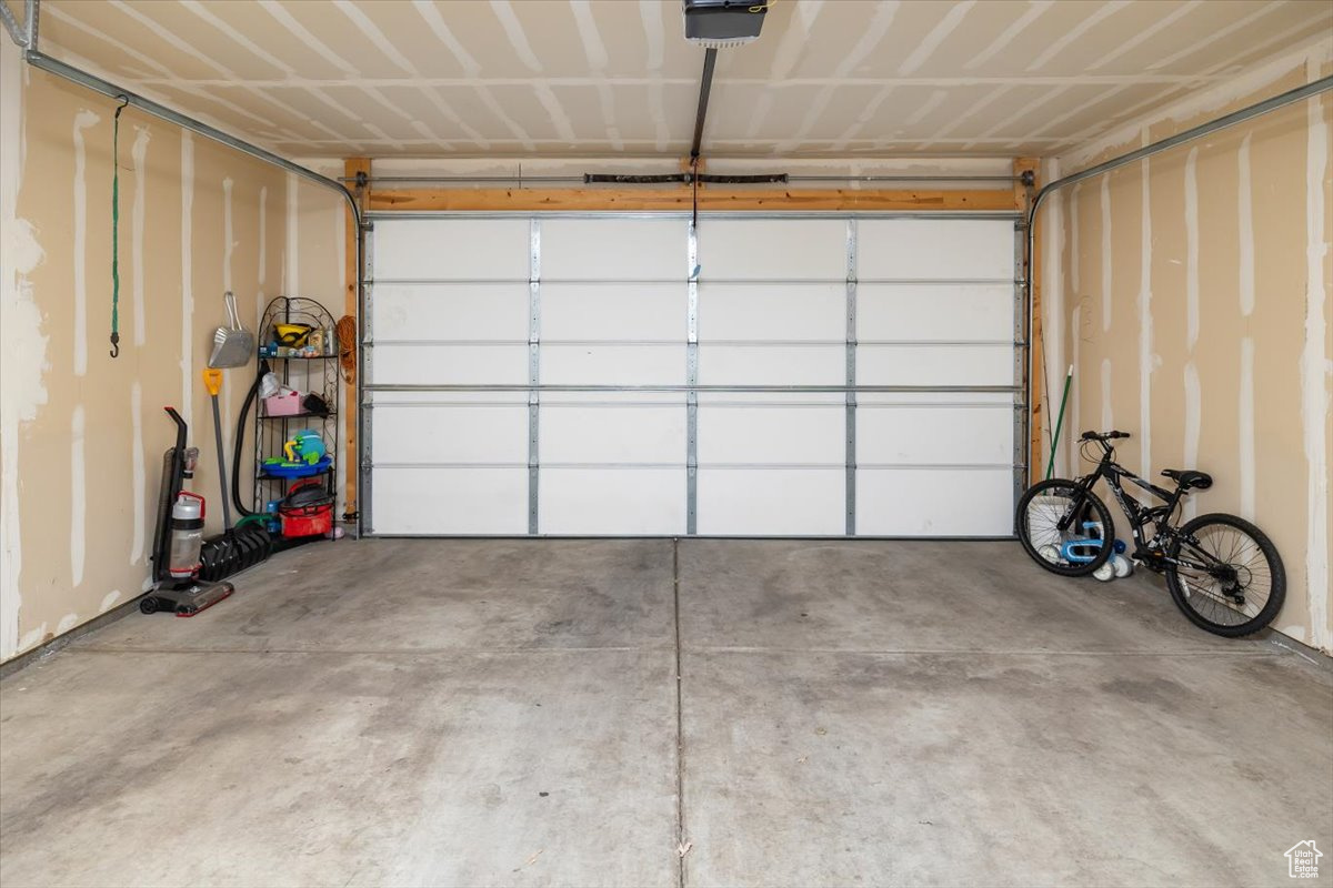 Garage featuring a garage door opener