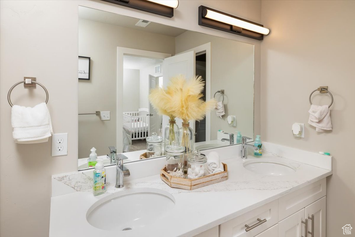 Bathroom with large vanity and dual sinks