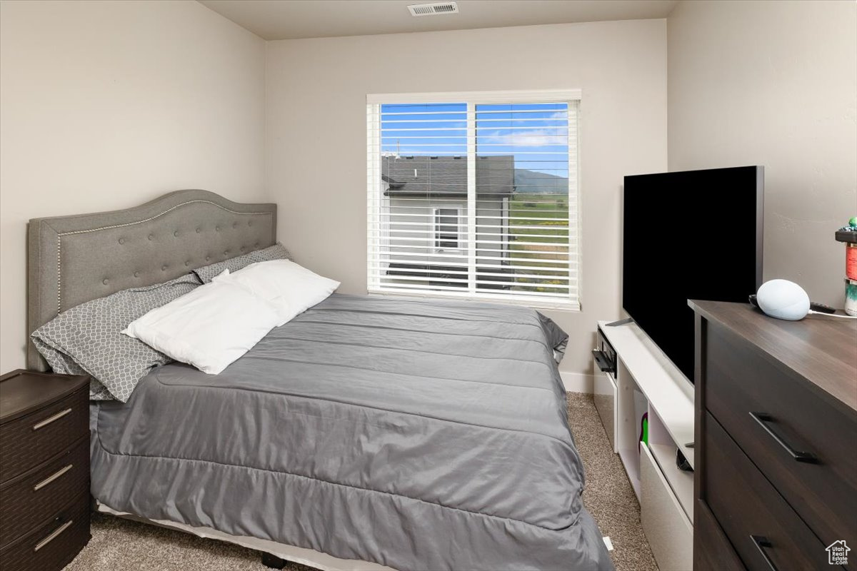 Bedroom featuring carpet flooring