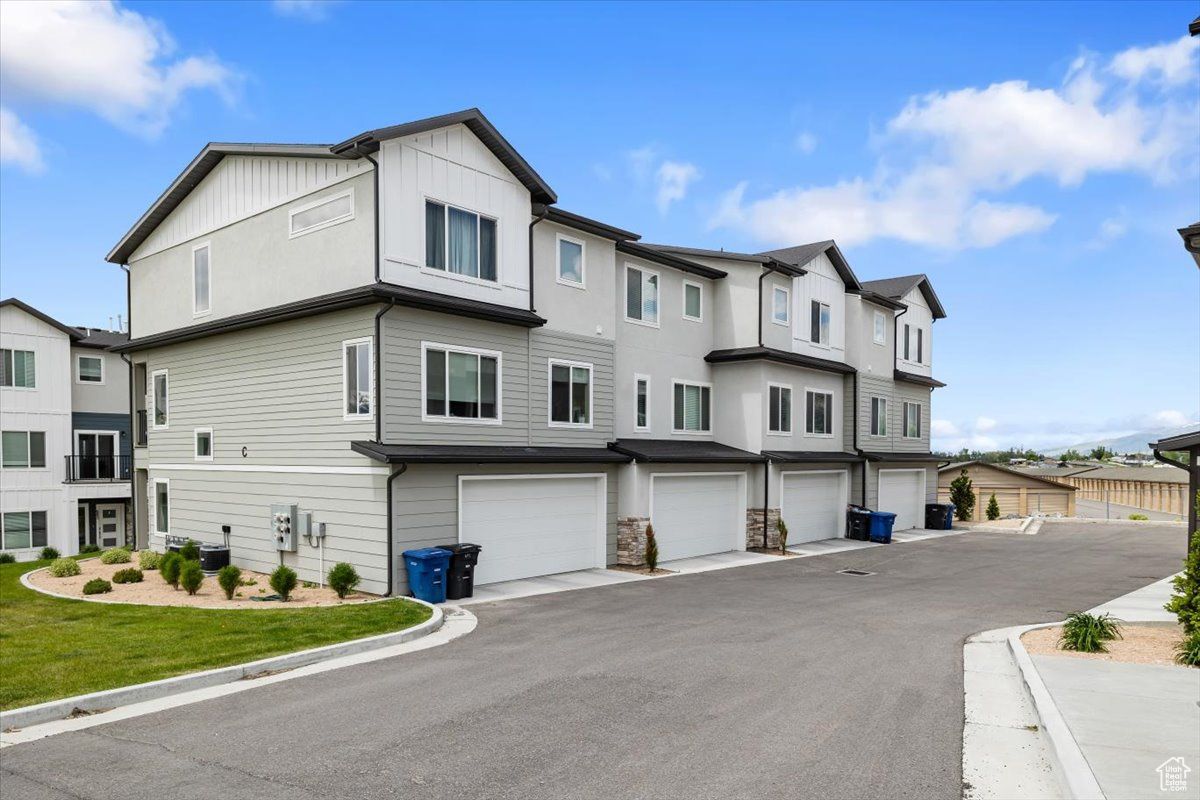 View of property with a garage