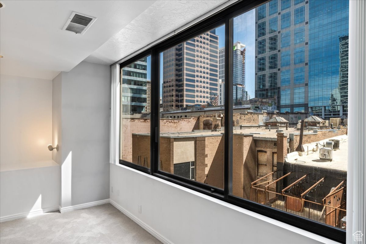 Interior space with a wealth of natural light and carpet