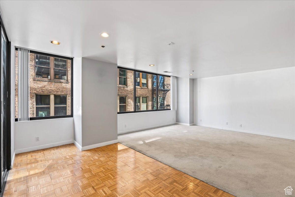 Spare room featuring light parquet flooring