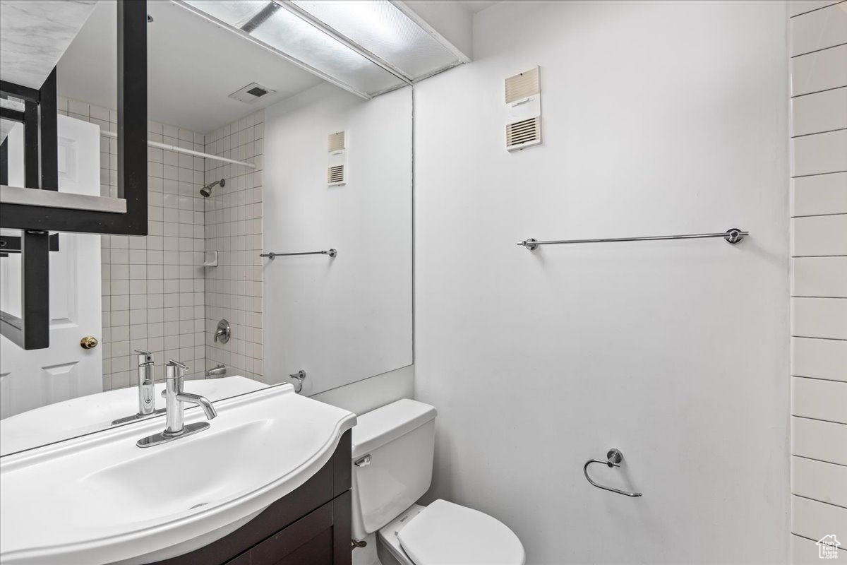 Bathroom with oversized vanity and toilet