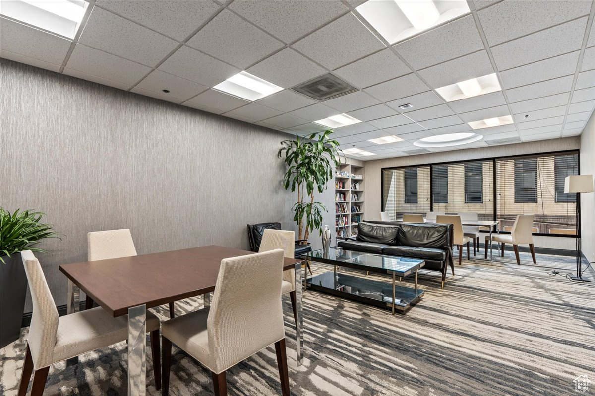 Dining room with a drop ceiling