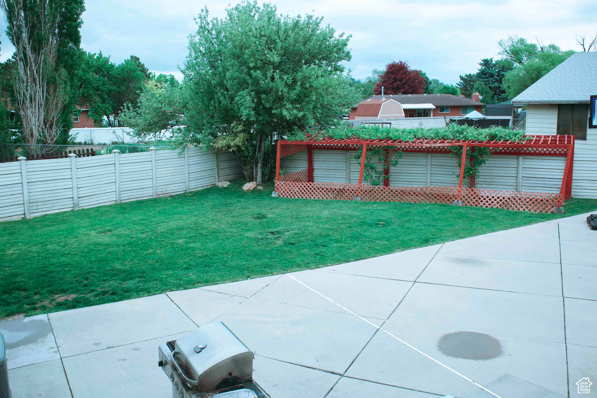 Exterior space with a patio area and a pergola